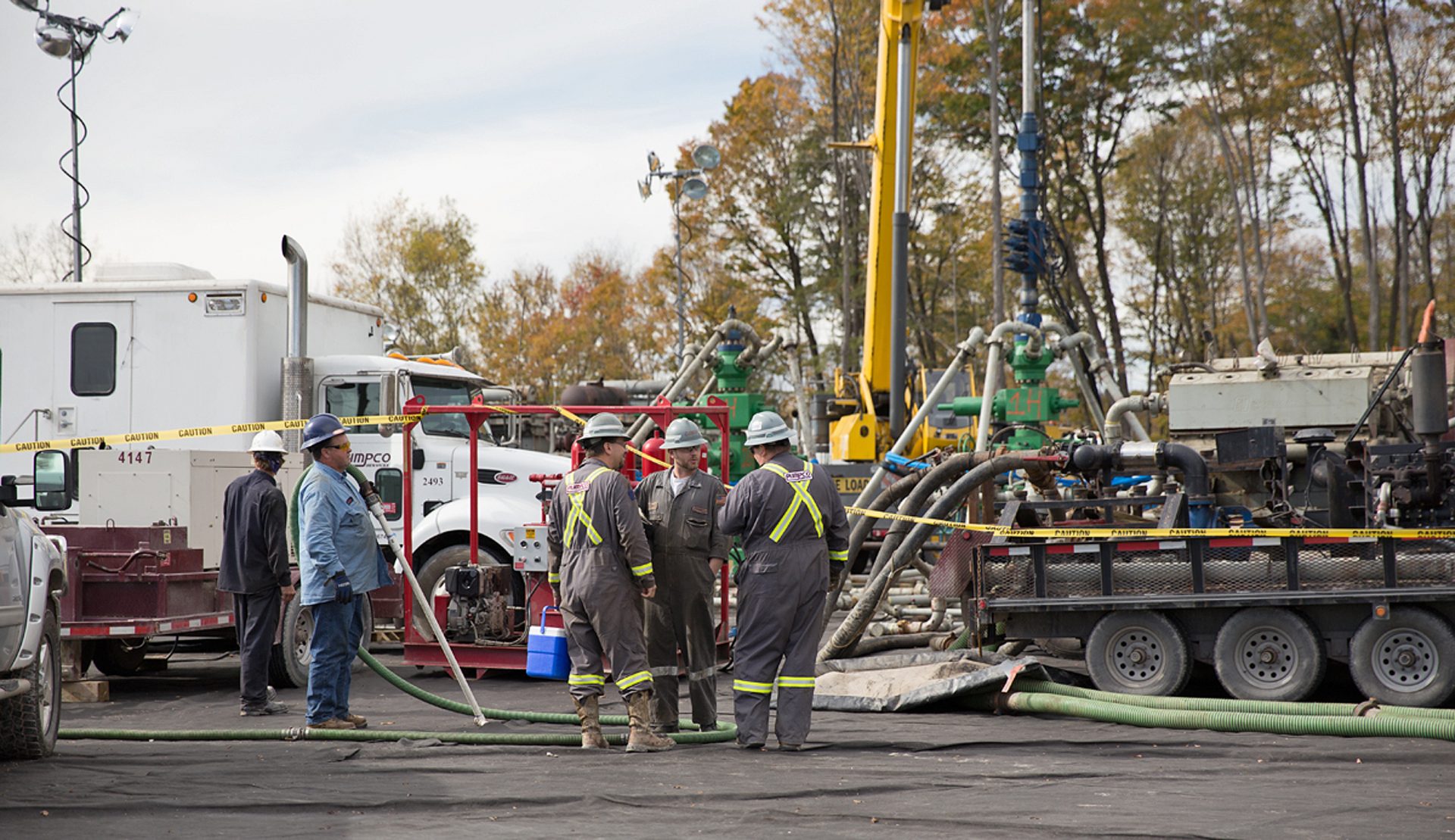 Workers vacuum fluids surrounding a frack site in Harford Township, Susquehanna County, Pa.