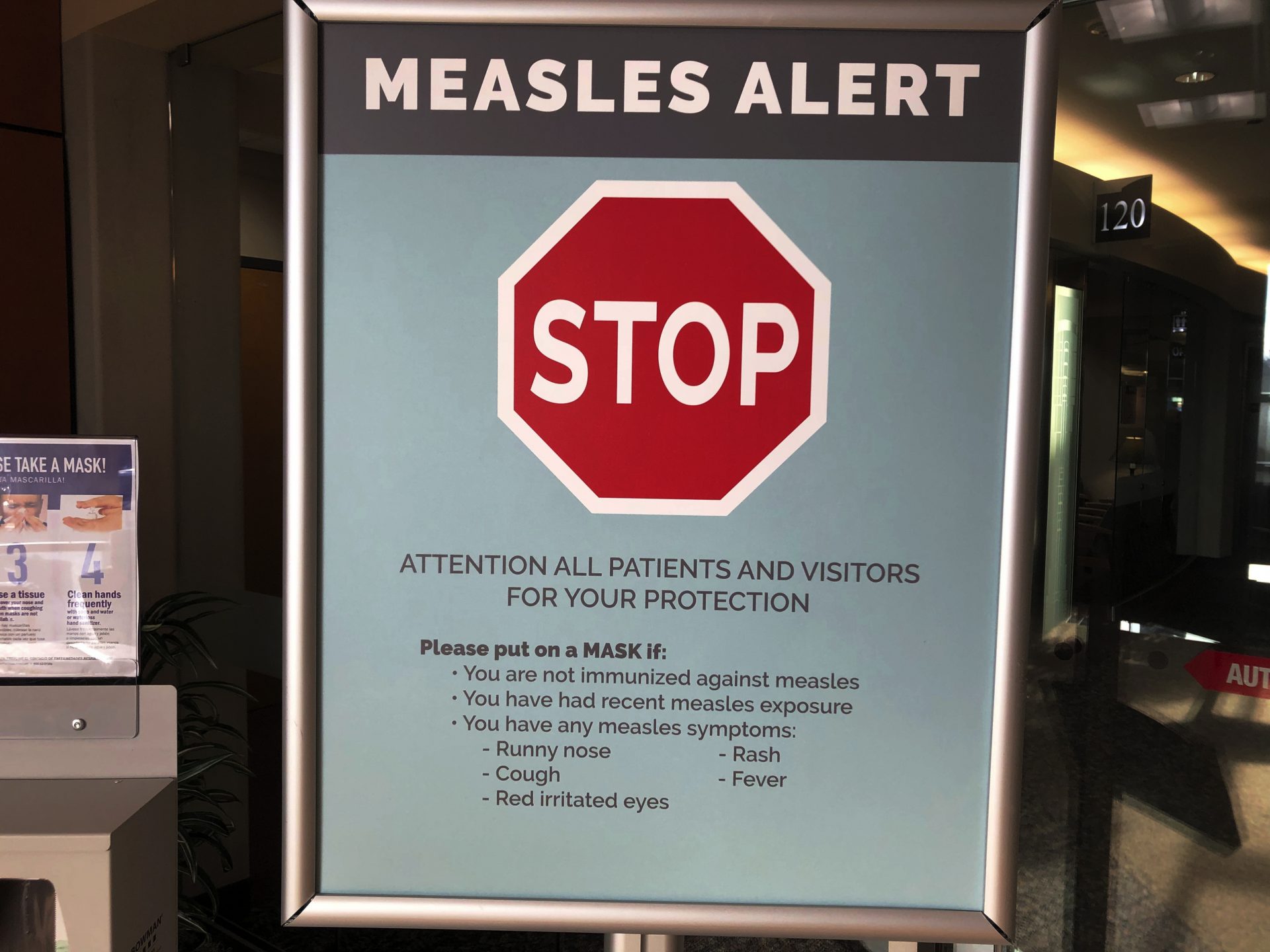 In this Jan. 30, 2019 file photo, signs posted at The Vancouver Clinic in Vancouver, Wash., warn patients and visitors of a measles outbreak.