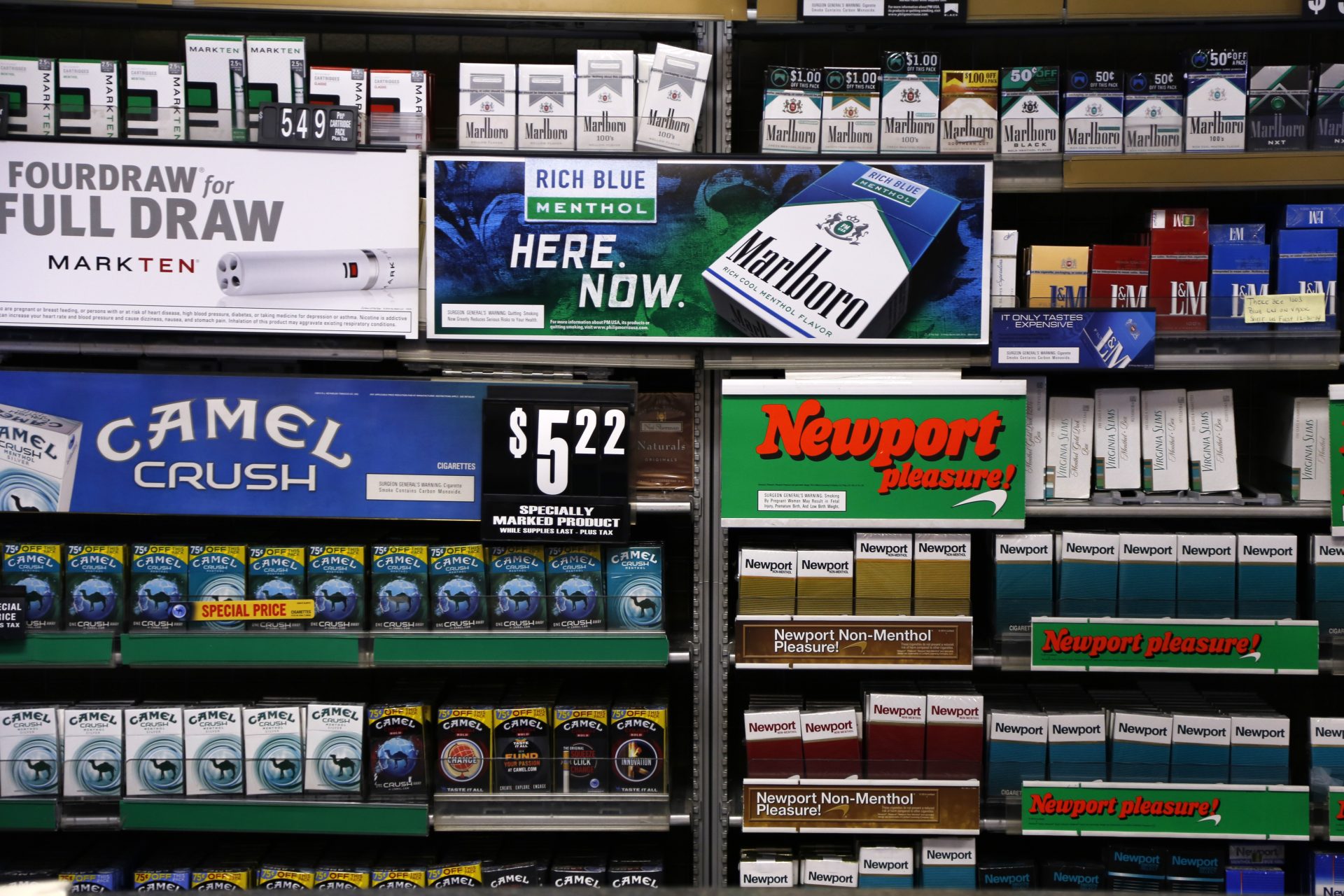 In this 2015 photo, several brands of cigarettes are on display at a Smoker Friendly shop in Pittsburgh.