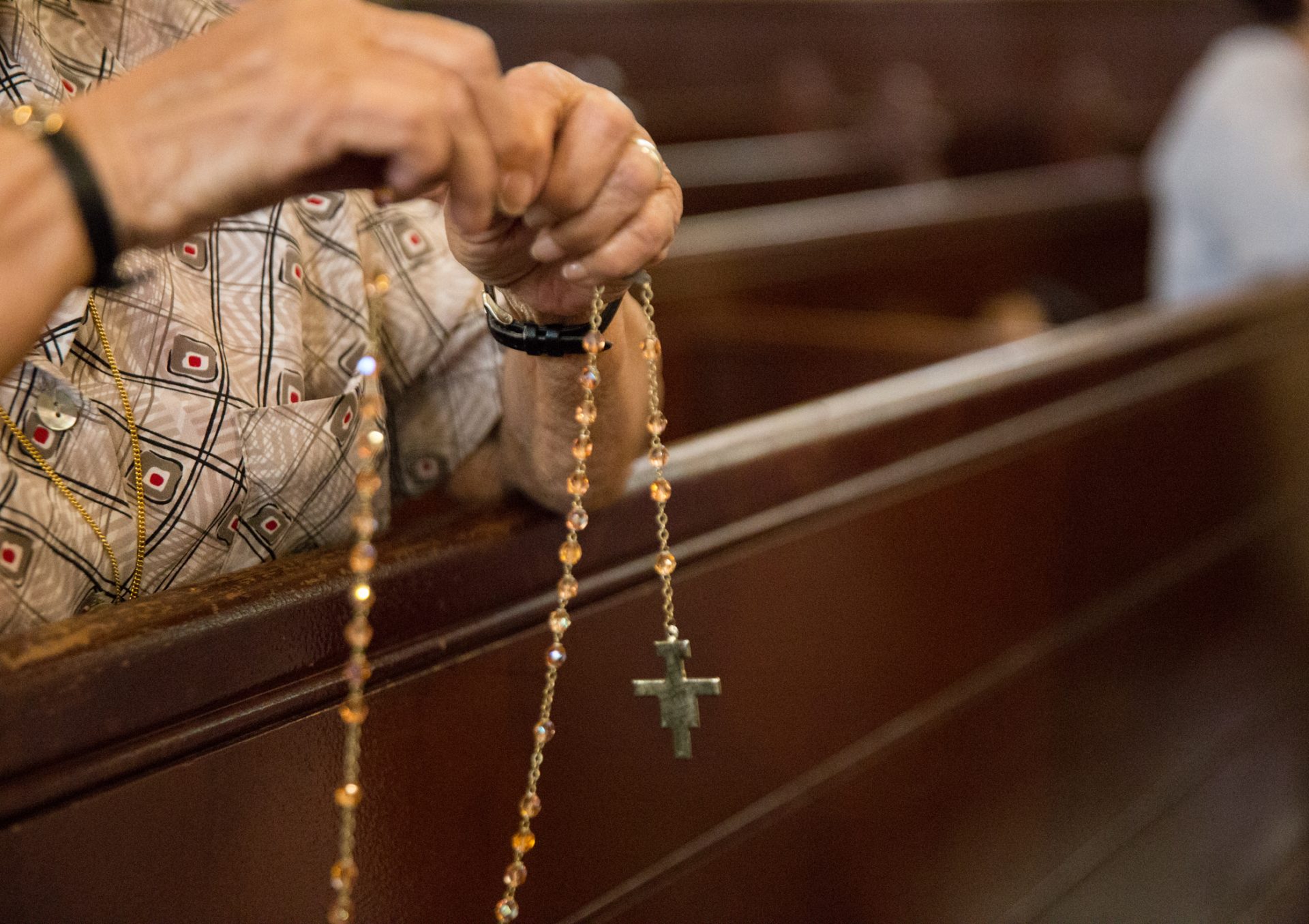 Parishioners pray the Rosary at Holy Infancy Roman Catholic Church in Bethlehem, Pennsylvania after mass on Tuesday, August 14, 2018. The same day, Pennsylvania Attorney General released his two-year grand jury investigation into widespread sexual abuse and cover-up within six Catholic dioceses across the state.