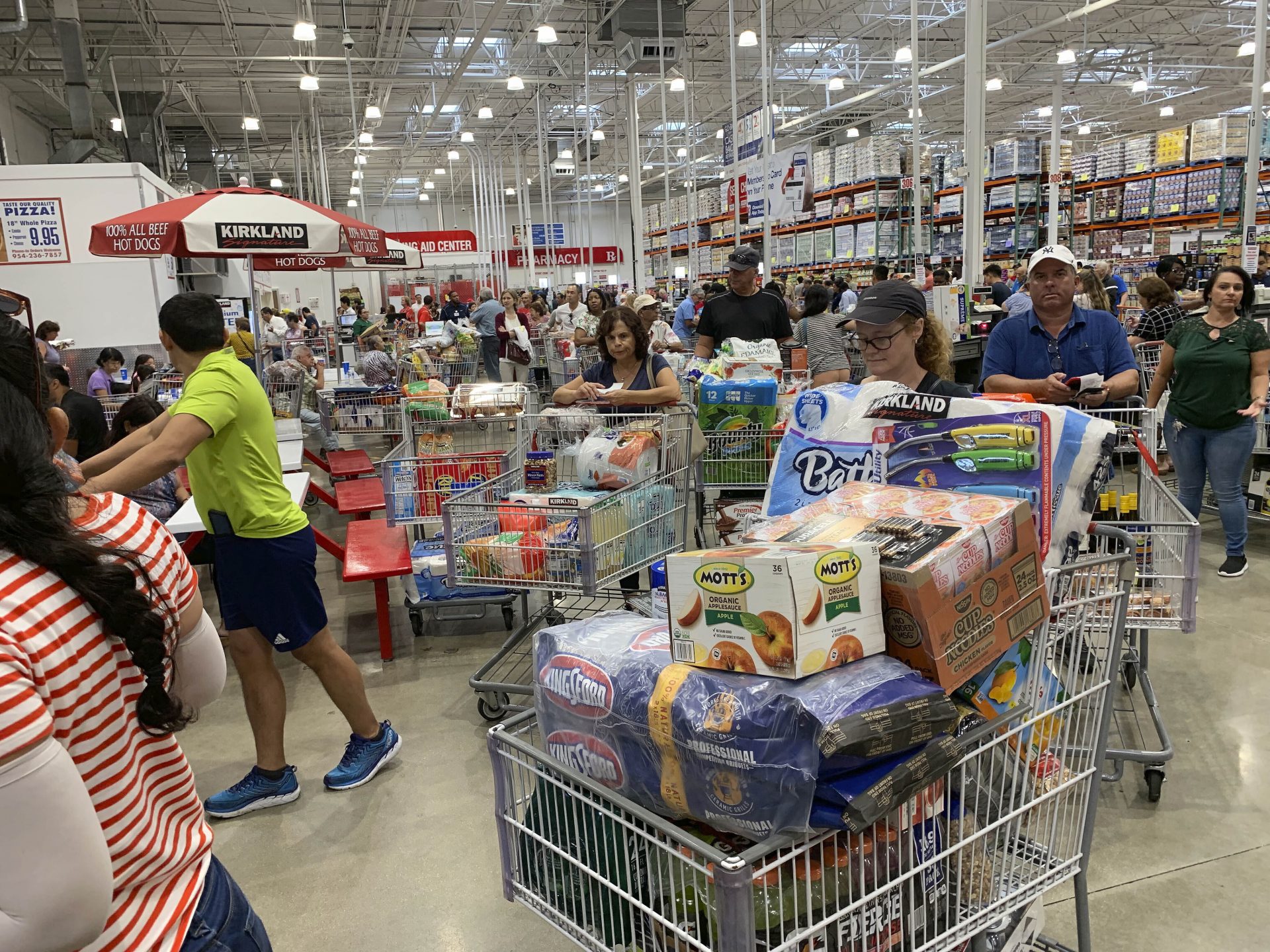 Shoppers wait in long lines at Costco, Thursday, Aug. 29, 2019, in Davie, Fla., as they stock up on supplies ahead of Hurricane Dorian.