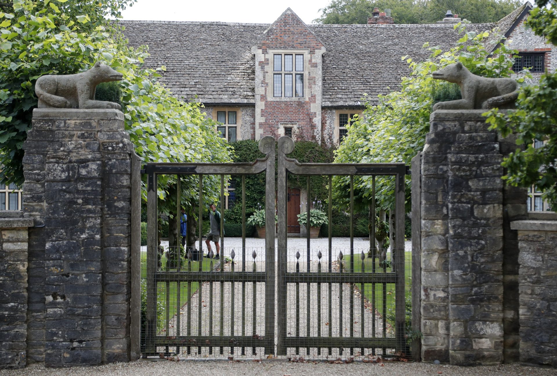 A gate protects the entrance of the Rooksnest estate near Lambourn, England, Tuesday, Aug. 6, 2019. The manor is the domain of Theresa Sackler, widow of one of Purdue Pharma’s founders and, until 2018, a member of the company’s board of directors. A complex web of companies and trusts are controlled by the family, and an examination reveals links between far-flung holdings, far removed from the opioid manufacturer’s headquarters in Stamford, Conn. 