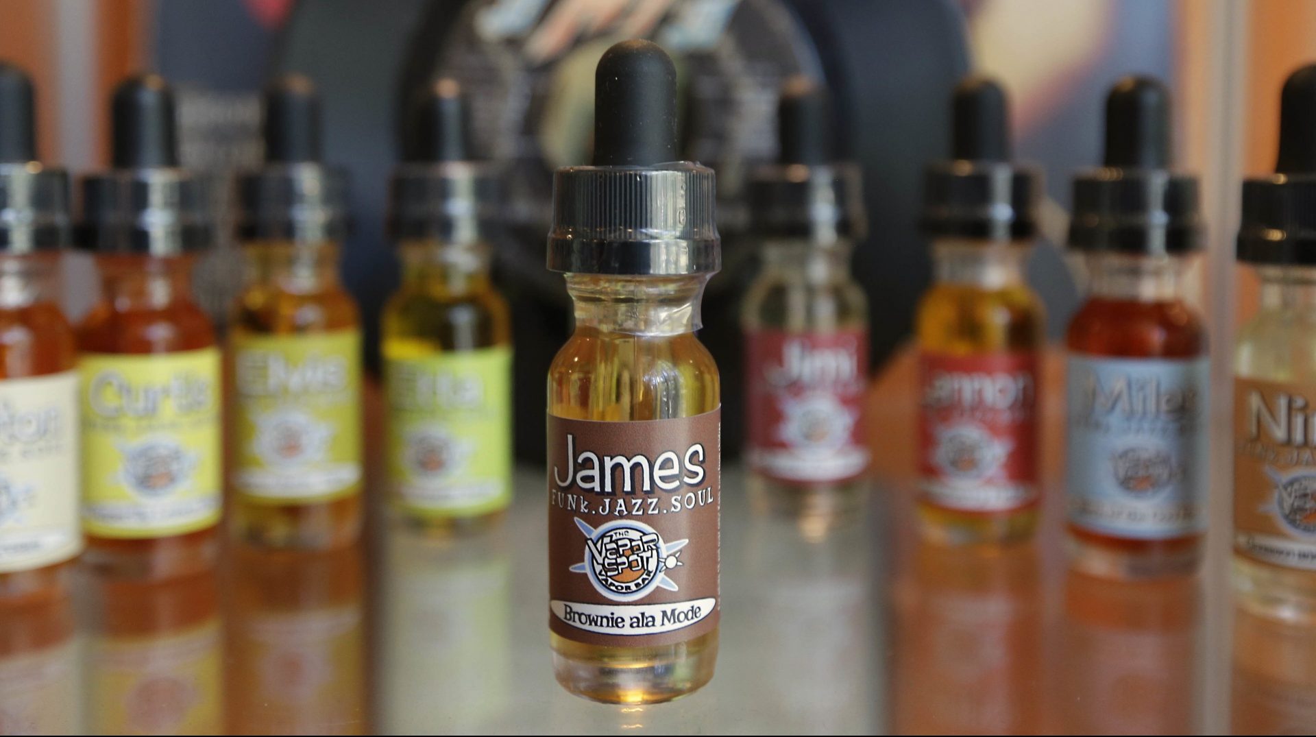 FILE PHOTO: Bottles of various flavors of vapor solution, known as "juice," for use in e-cigarettes at a shop in Sacramento, Calif..