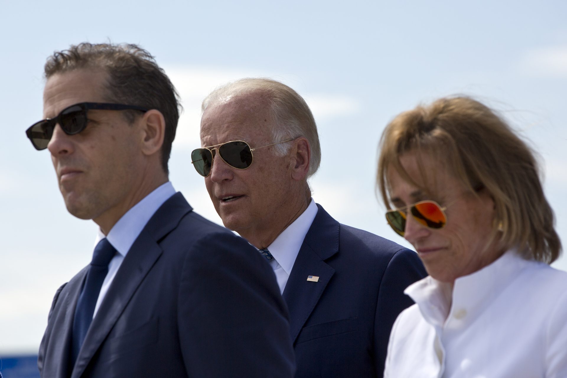 Joe Biden, center, his son Hunter Biden, left, and his sister Valerie Biden Owens, right, joined by other family members during a ceremony to name a national road after his late son Joseph R. "Beau" Biden III, in the village of Sojevo, Kosovo, on Wednesday, Aug. 17, 2016.