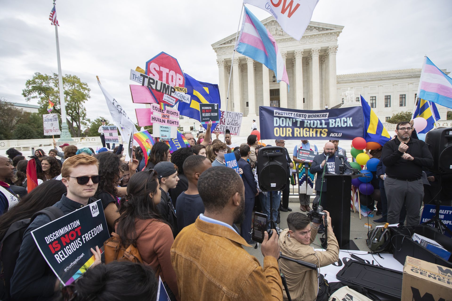 LGBT supporters gather in front of the U.S. Supreme Court, Tuesday, Oct. 8, 2019, in Washington. The Supreme Court is set to hear arguments in its first cases on LGBT rights since the retirement of Justice Anthony Kennedy. Kennedy was a voice for gay rights while his successor, Brett Kavanaugh, is regarded as more conservative.