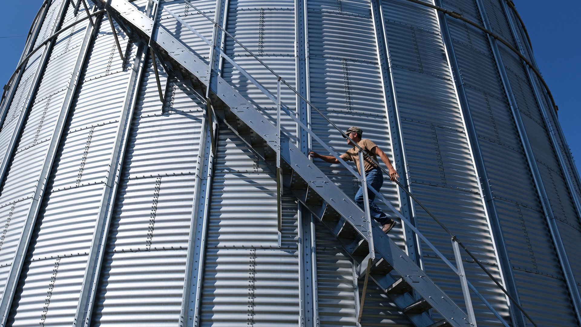 Grain farmer Don Cairns walks to the top of a grain silo Sept. 25, 2019, at Cairns Family Farm in Sadsbury Township, Pennsylvania.