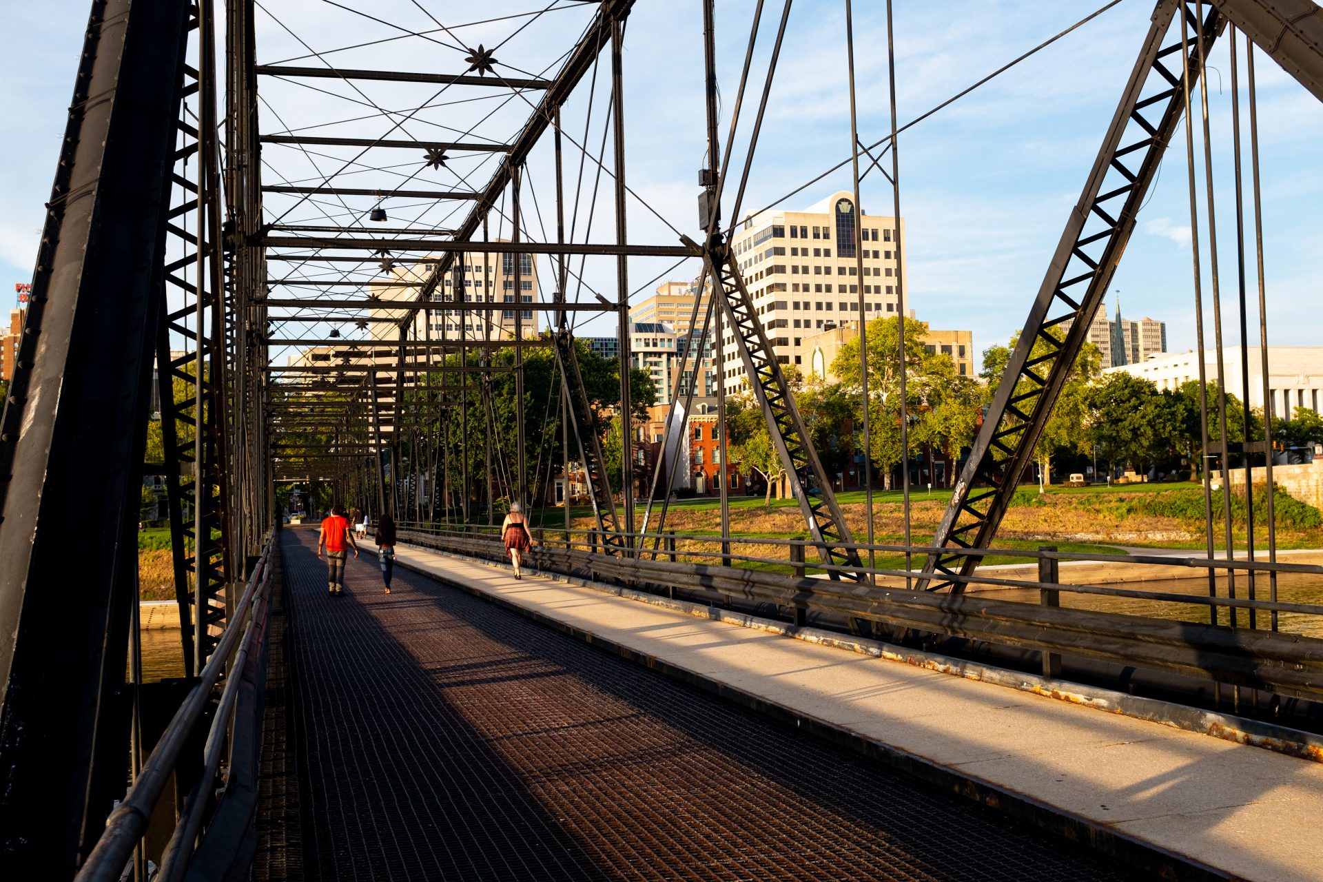 Pedestrians walk across a bridge over the Susquehanna River in Harrisburg on Aug. 19.