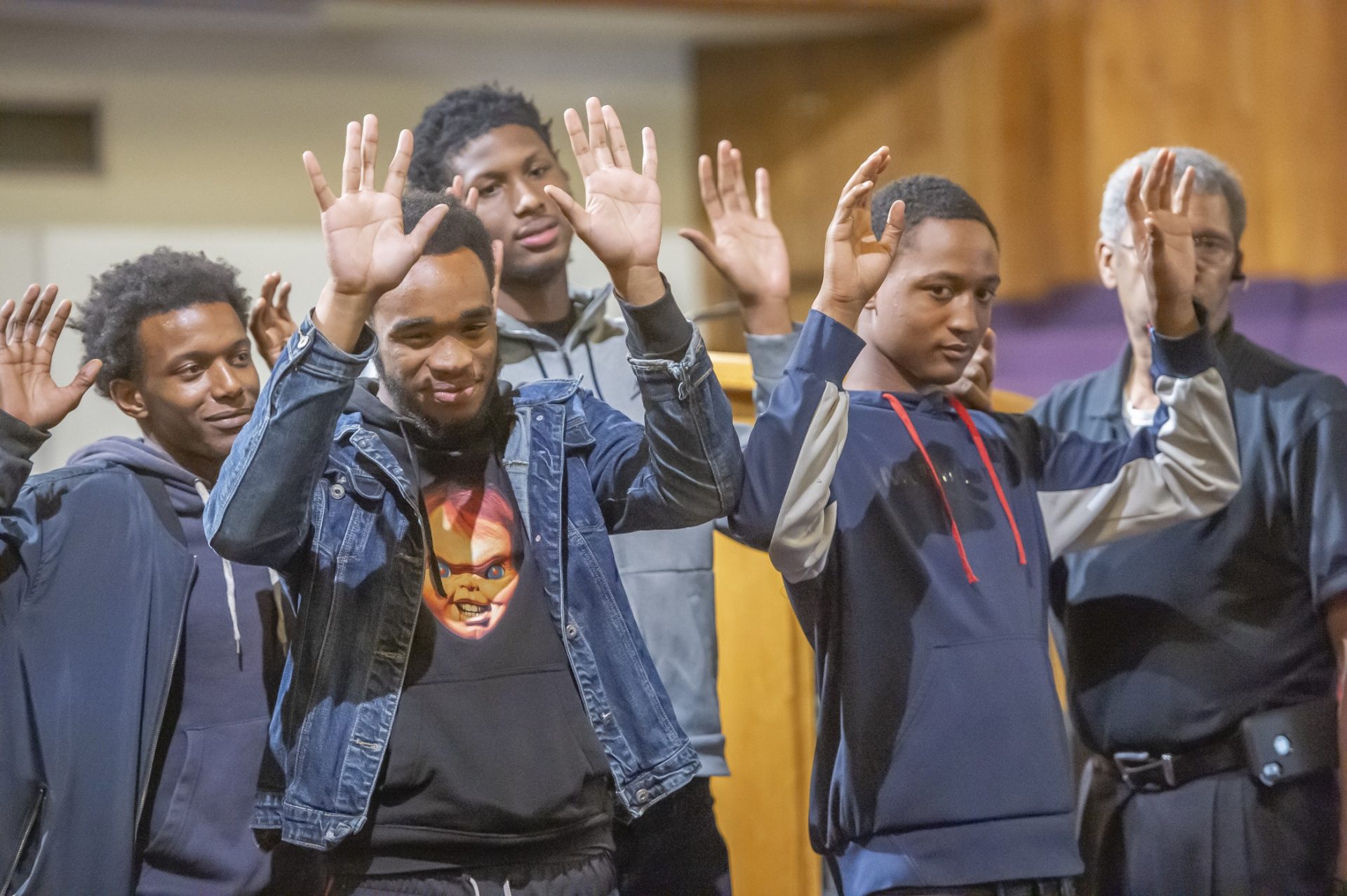 In a role playing exercise young adults who were participants in the Institute for the Development of African American Youth work with retired police sergeant De Lacy Davis on the best way to interact with police.