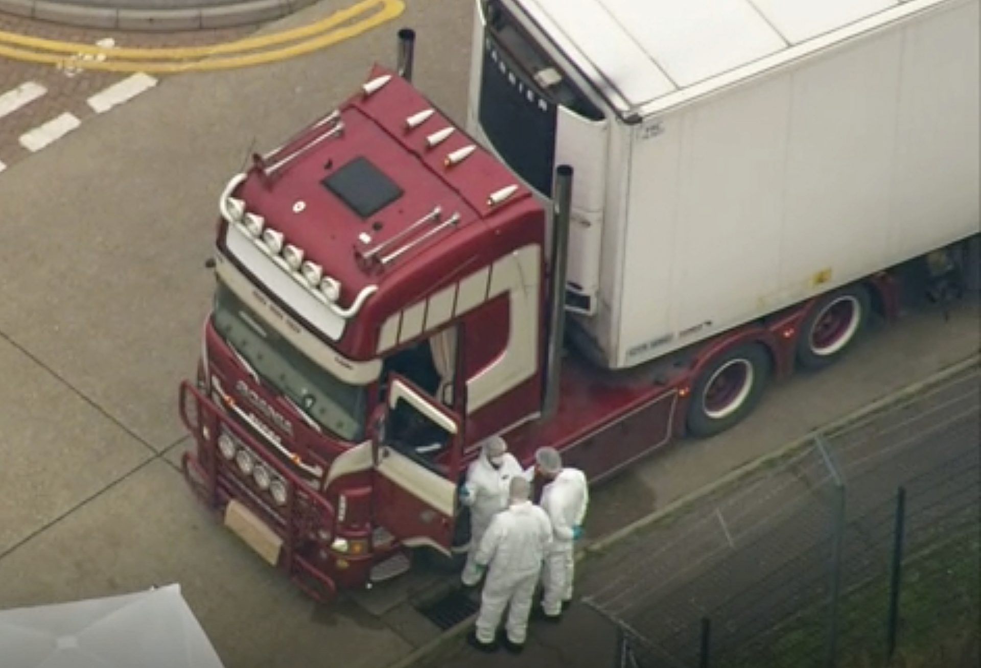 An aerial view as police forensic officers attend the scene after a truck was found to contain a large number of dead bodies, in Thurrock, South England, early Wednesday Oct. 23, 2019. Police in southeastern England said that 39 people were found dead Wednesday inside a truck container believed to have come from Bulgaria.
