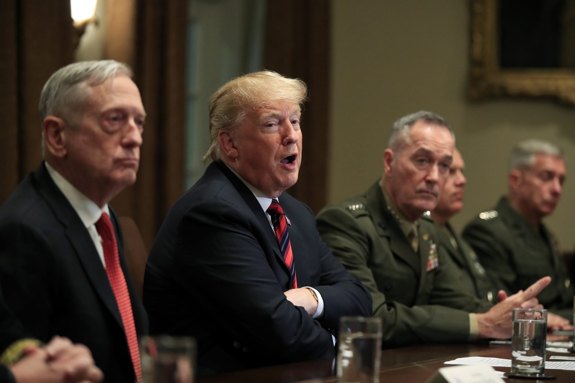FILE PHOTO: President Donald Trump with, from left, Defense Secretary Jim Mattis, Trump, Chairman of the Joint Chiefs of Staff Gen. Joseph Dunford and Marine Corps Commandant Gen. Robert Neller, speaks during a briefing with senior military leaders in the Cabinet Room at the White House in Washington, Tuesday, Oct. 23, 2018.