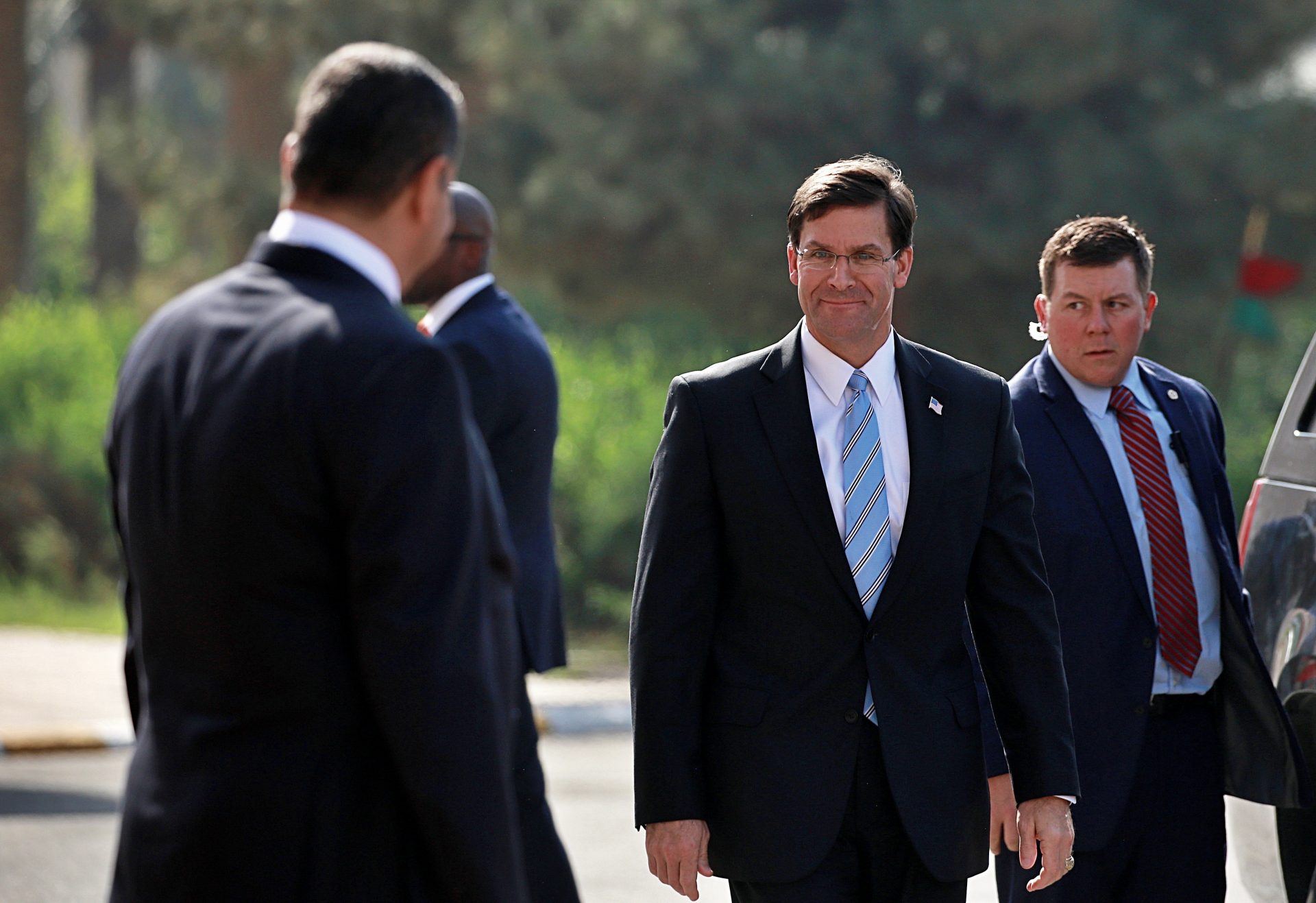 Iraqi Defense Minister Najah al-Shammari, left, prepares to welcome the visiting U.S. Defense Secretary Mark Esper, center right, at the Ministry of Defense, Baghdad, Iraq, Wednesday, Oct. 23, 2019. Esper has arrived in Baghdad on a visit aimed at working out details about the future of American troops that are withdrawing from Syria to neighboring Iraq.