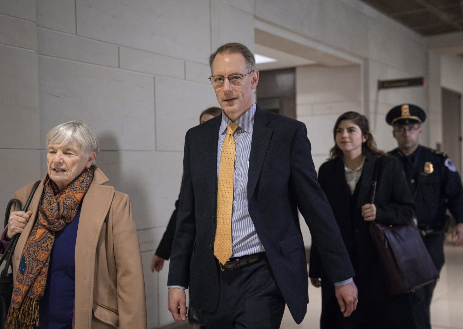 Mark Sandy, a career employee in the White House Office of Management and Budget, arrives at the Capitol to testify in the House Democrats' impeachment inquiry about President Donald Trump's effort to tie military aid for Ukraine to investigations of his political opponents, in Washington, Saturday, Nov. 16, 2019.