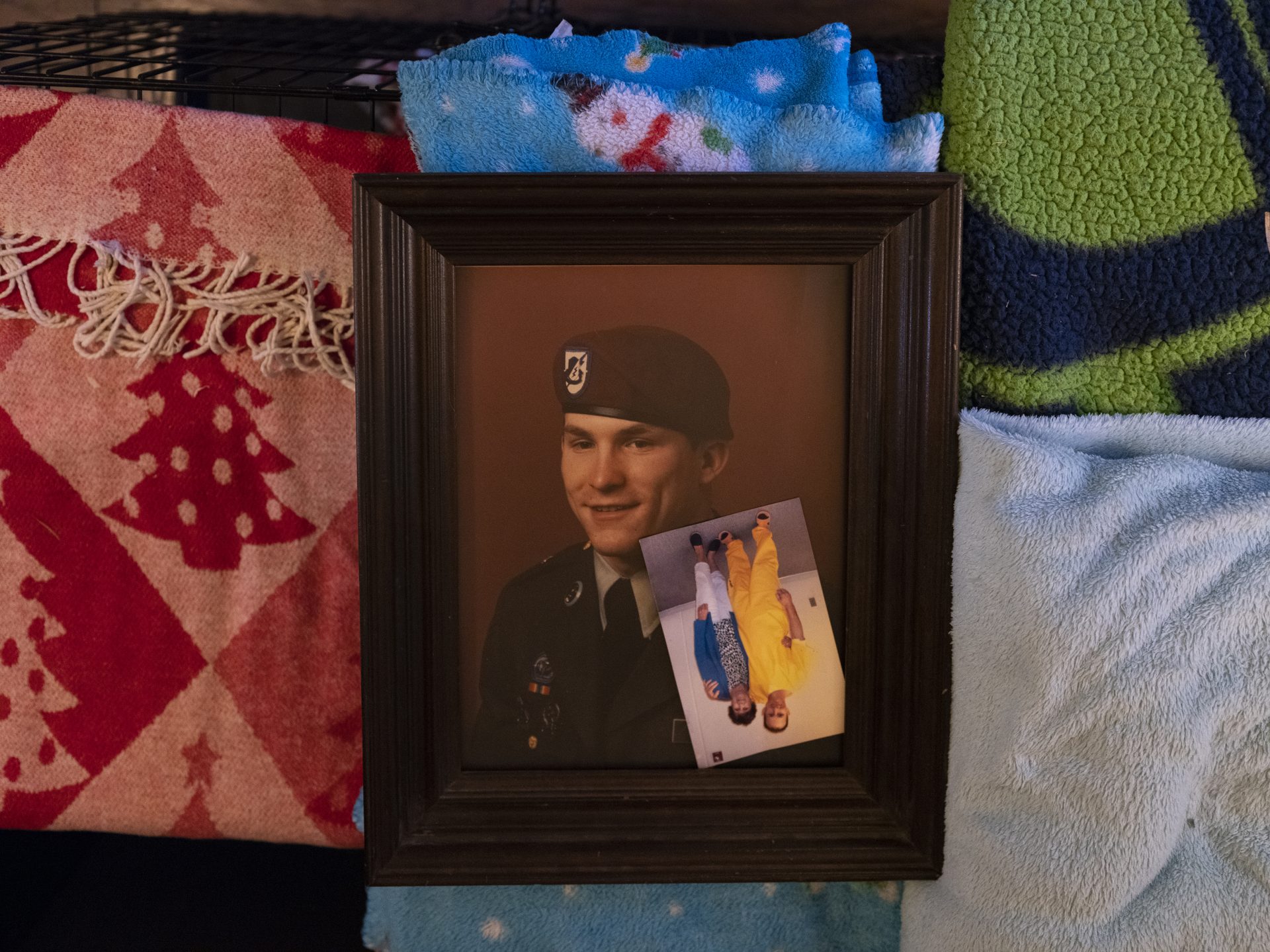 Photos of Chuck in his military uniform and with Donna during one of their few visits while he was incarcerated.