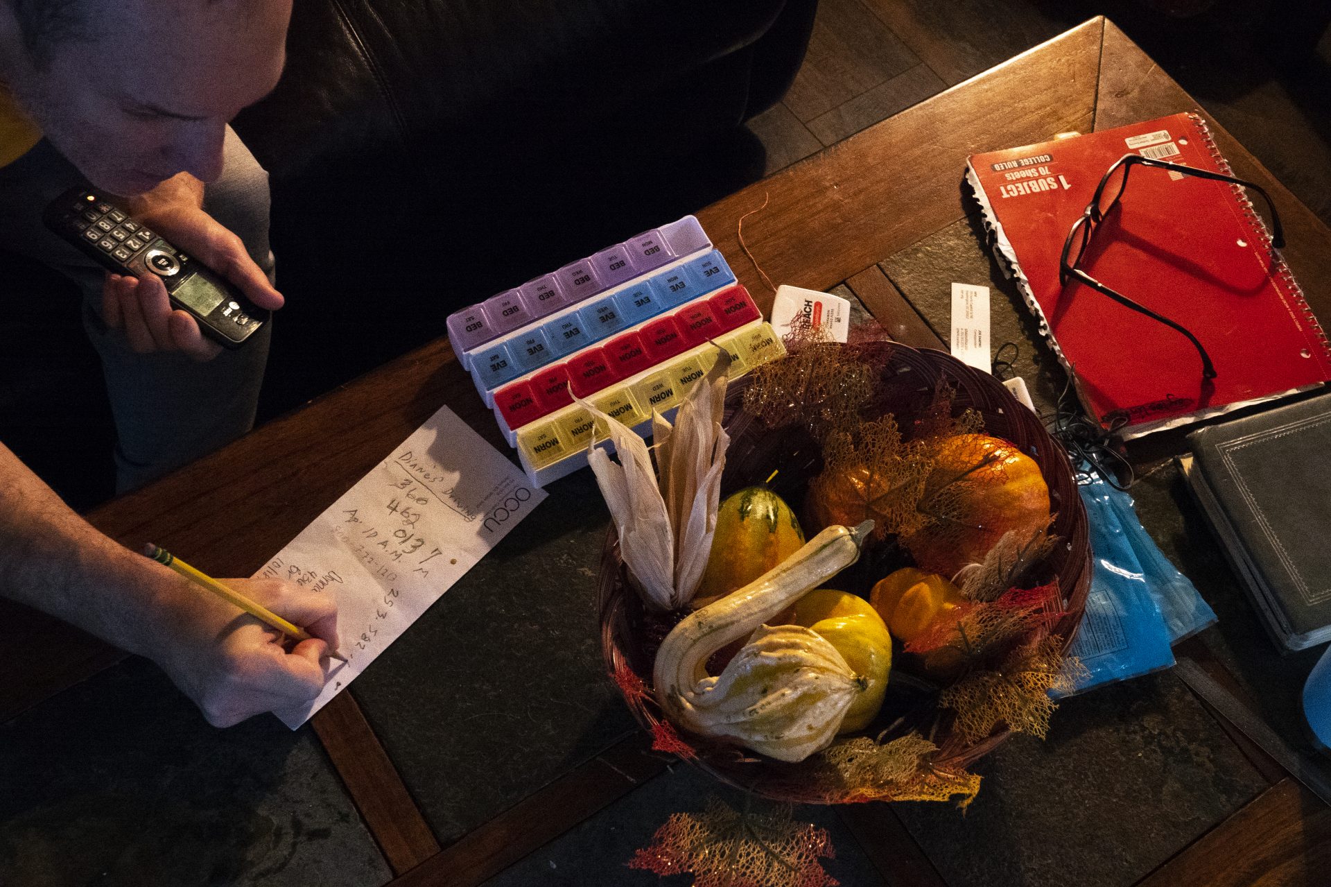 Chuck wrote down information while trying to reach his psychiatrist at the Veterans Affairs hospital. He was hoping to be prescribed medication to reduce his tremors, which have disrupted his life ever since he returned from prison.