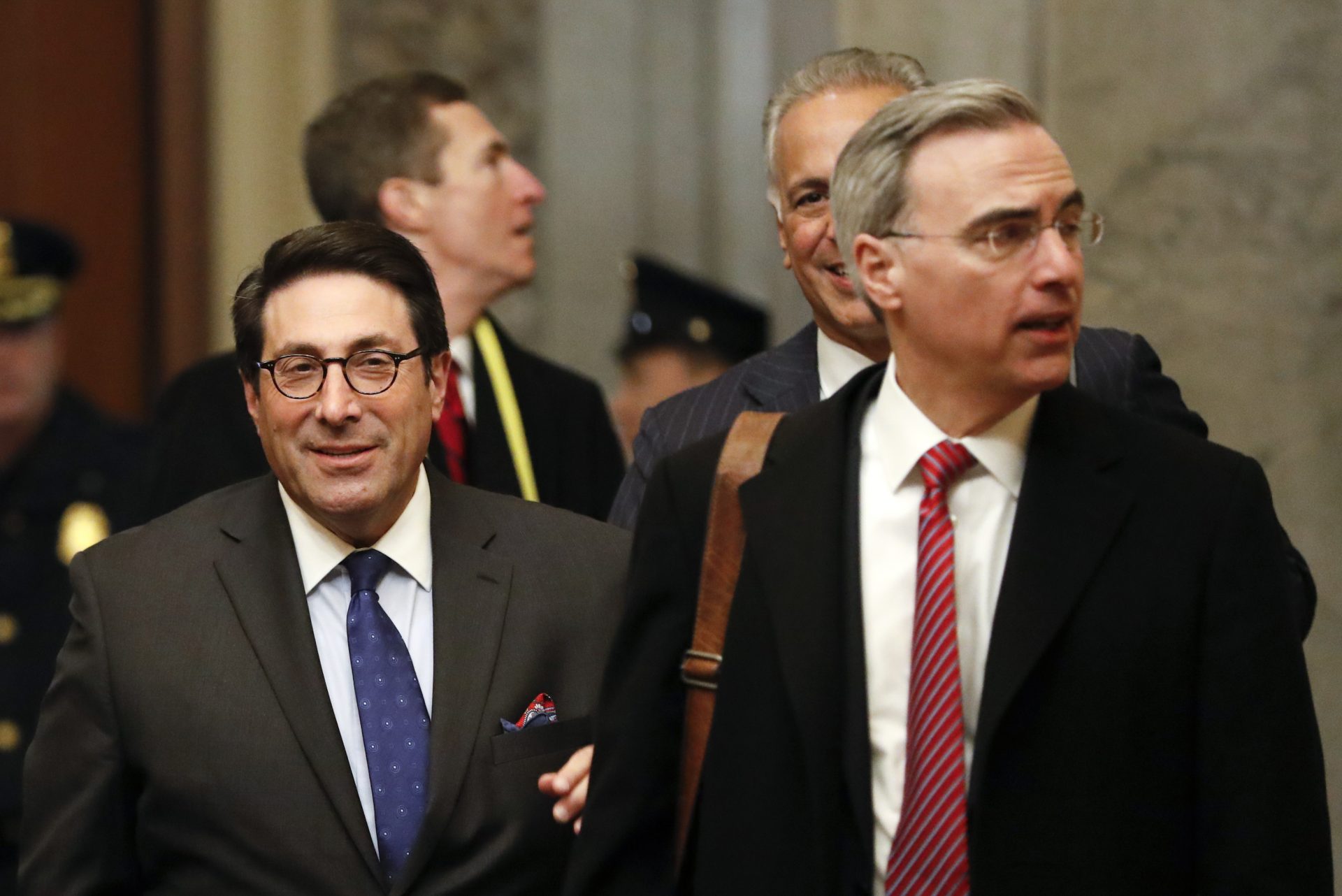 President Donald Trump's personal attorney Jay Sekulow, left, walks with White House Counsel Pat Cipollone, right, as they arrive at the Capitol in Washington during the impeachment trial of President Donald Trump on charges of abuse of power and obstruction of Congress, Friday, Jan. 24, 2020.