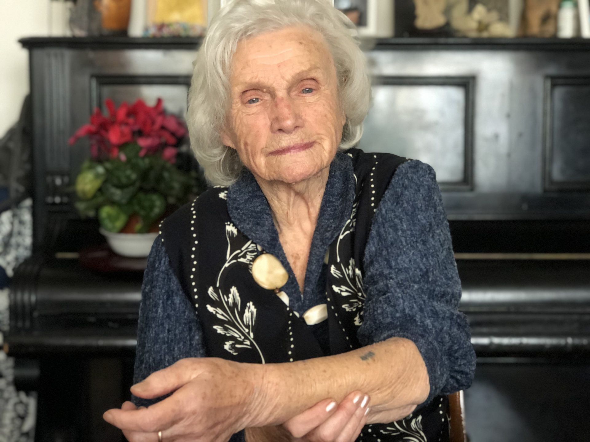 Auschwitz survivor Alina Dabrowska, 96, shows her Auschwitz prisoner number tattoo at her home in Warsaw. She was sent to Auschwitz after she was caught by the Nazis helping the allied forces in German-occupied Poland during World War II.