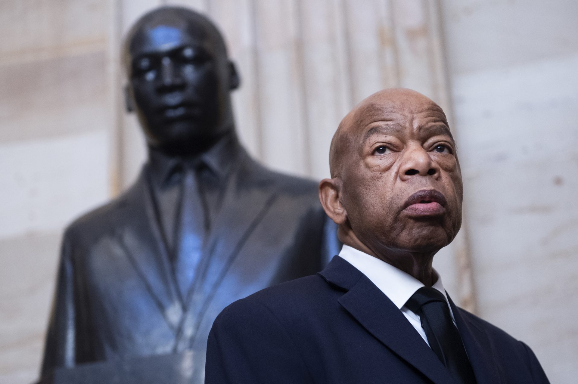 Georgia Rep. John Lewis near the statue of Martin Luther King Jr. in the Capitol Rotunda in Washington, D.C., earlier this year. At StoryCorps in 2018, Lewis talked about meeting King in Montgomery, Ala., at 18.