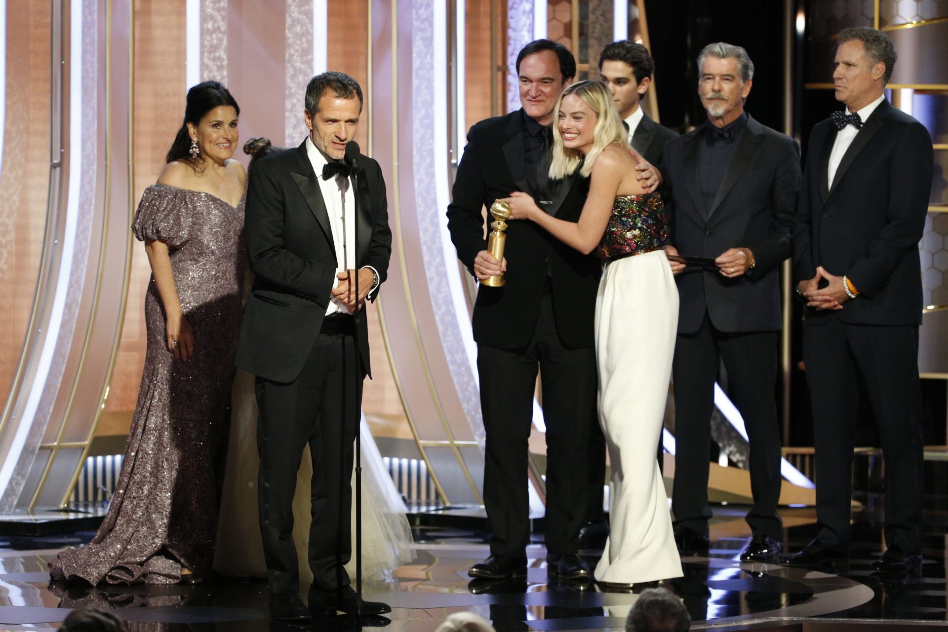 This image released by NBC shows Shannon McIntosh, from left, David Heyman, Quentin Tarantino and Margot Robbie accepting the award for best motion picture comedy for "Once Upon A Time...In Hollywood" at the 77th Annual Golden Globe Awards at the Beverly Hilton Hotel in Beverly Hills, Calif., on Sunday, Jan. 5, 2020.