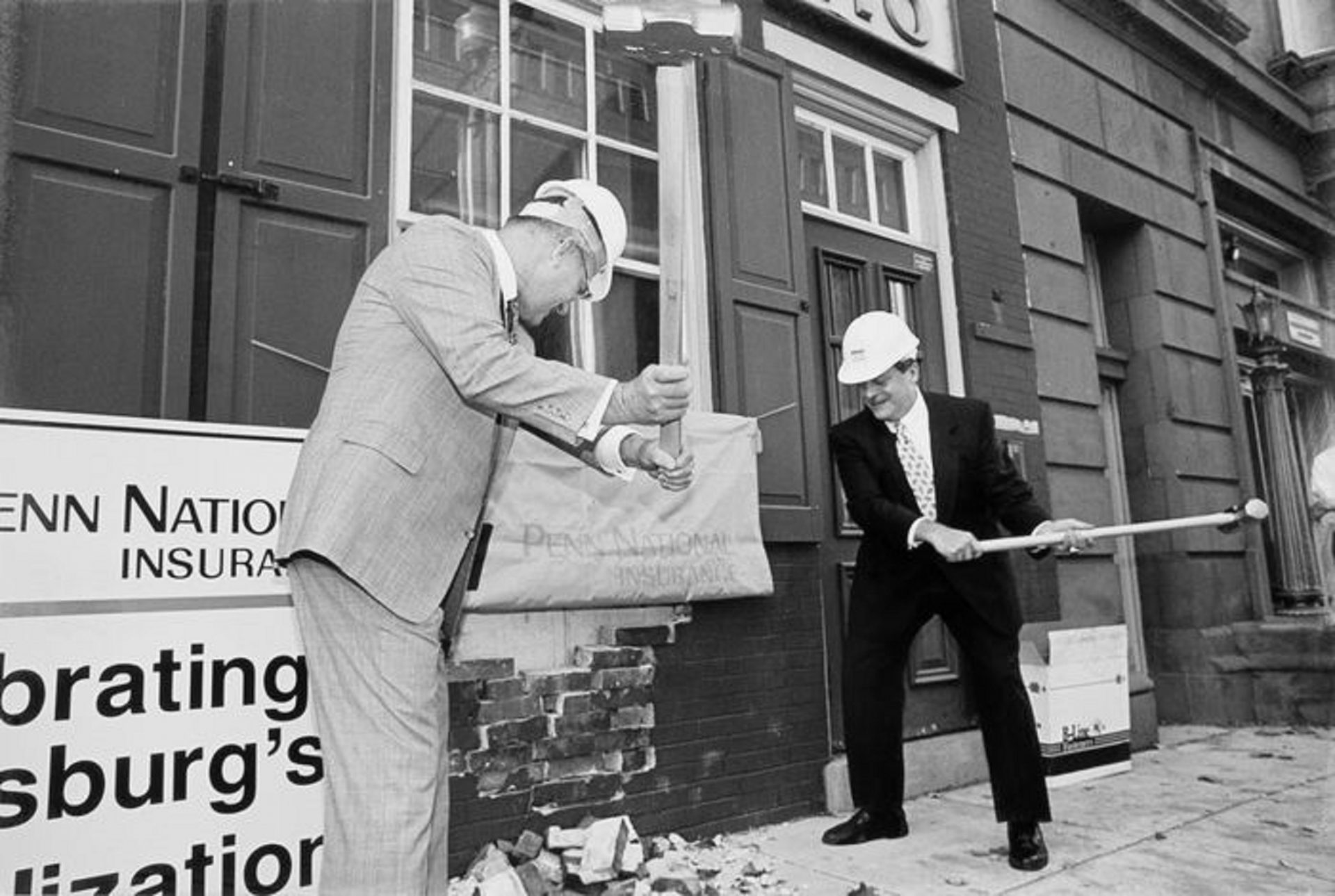 FILE PHOTO: Former CEO Jim Taylor (left) and former Harrisburg Mayor Stephen Reed kick off work at the future headquarters for Penn National Insurance at Market Square in Harrisburg.