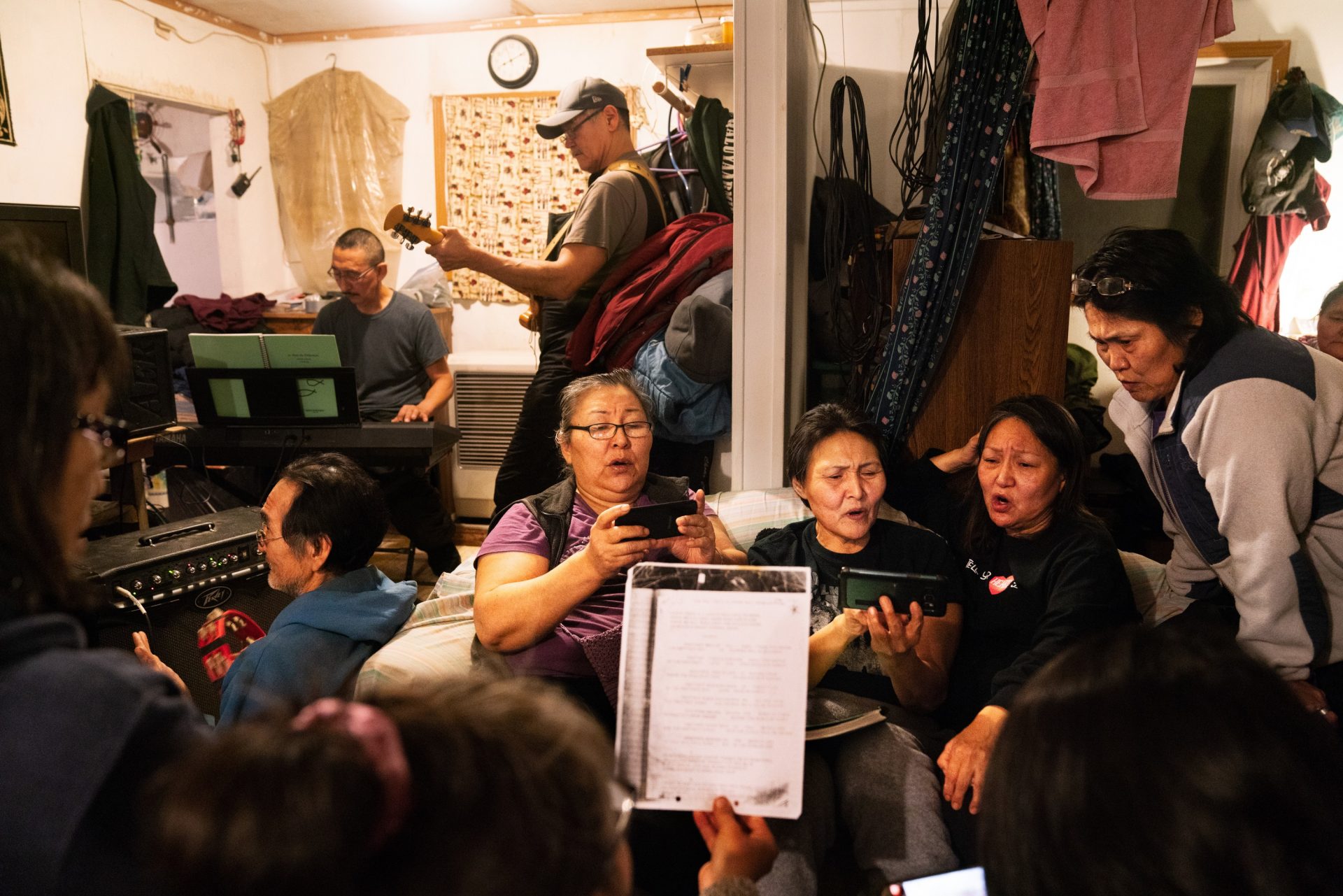 On Sunday night, people gather and practice singing hymns for George Paul Miisaq's funeral. Miisaq was living in Anchorage and his body was flown back to Toksook Bay to be buried.