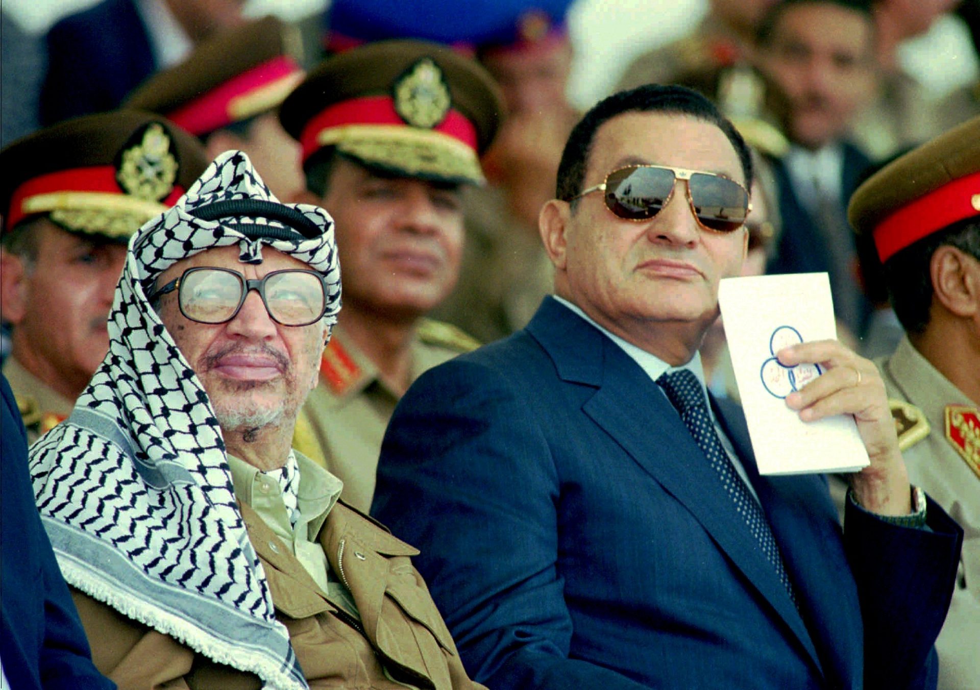Palestinian Leader Yasser Arafat, left, and Egyptian President Hosni Mubarak watch an Egyptian airforce air show at a base near the town of Bilbeis, 31 miles north of Cairo, Sunday July 14,1996. Arafat is in Egypt for talks with the Egyptian President.