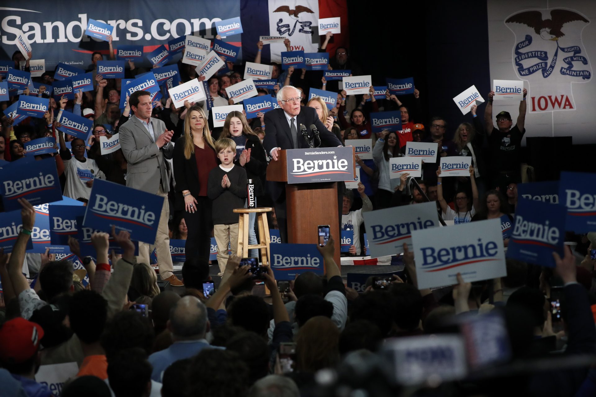 Democratic presidential candidate Sen. Bernie Sanders, I-Vt., accompanied by his family, speaks to supporters at a caucus night campaign rally in Des Moines, Iowa, Monday, Feb. 3, 2020.