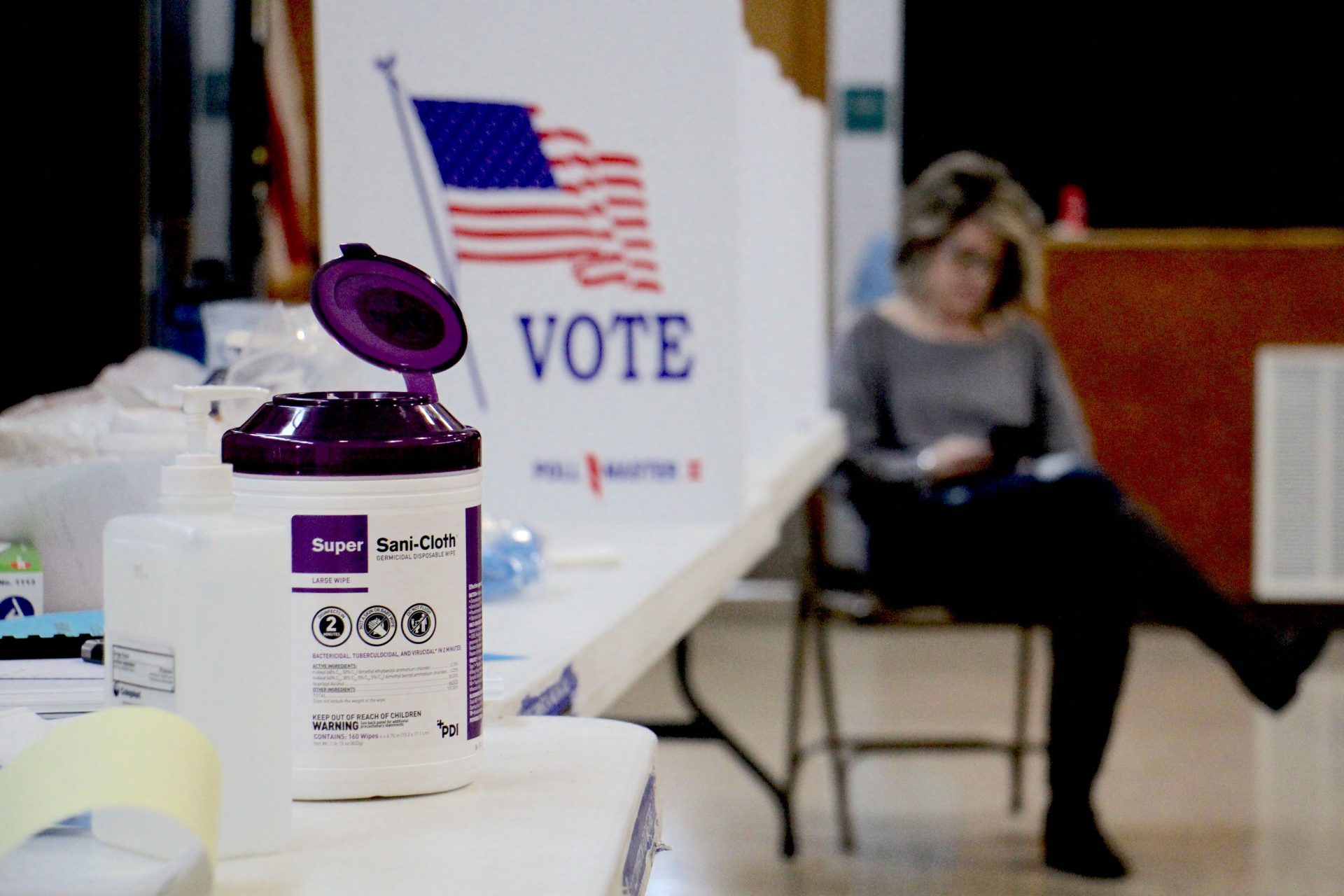 Poll worker Dina Sebold waits for voters at Cecelia Snyder Middle School in Bensalem during a special election for a vacant seat in the Pennsylvania House of Representatives. Hand sanitizer and wipes were made available to voters, many of whom brought their own pens.