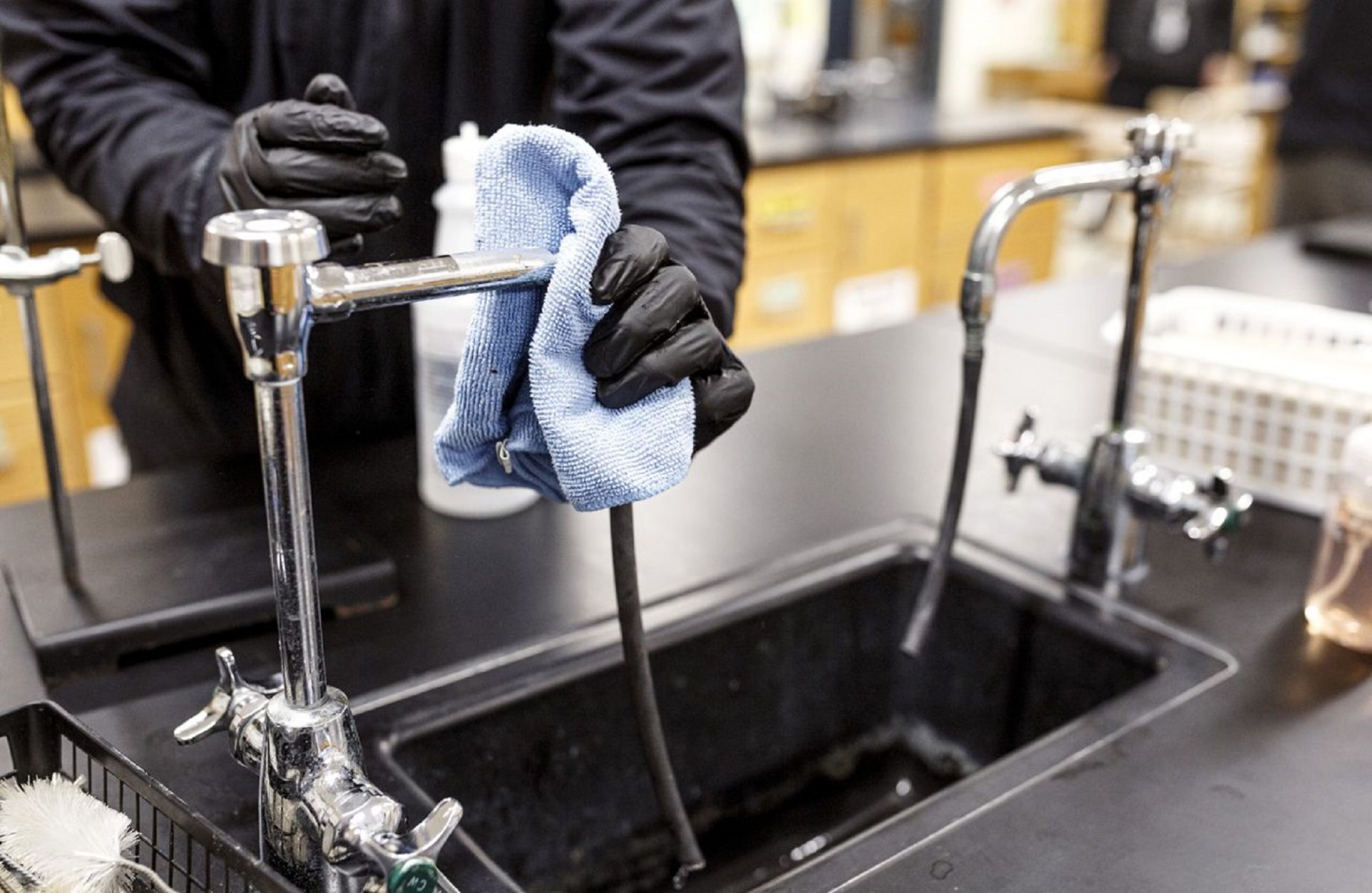 All high-touch areas in a chemistry classroom are wiped down with a cleaning solution applied to a cloth. Custodial staff at East Pennsboro High School sanitize surfaces each day as a precautionary measure for the coronavirus, known as COVID-19, March 11, 2020