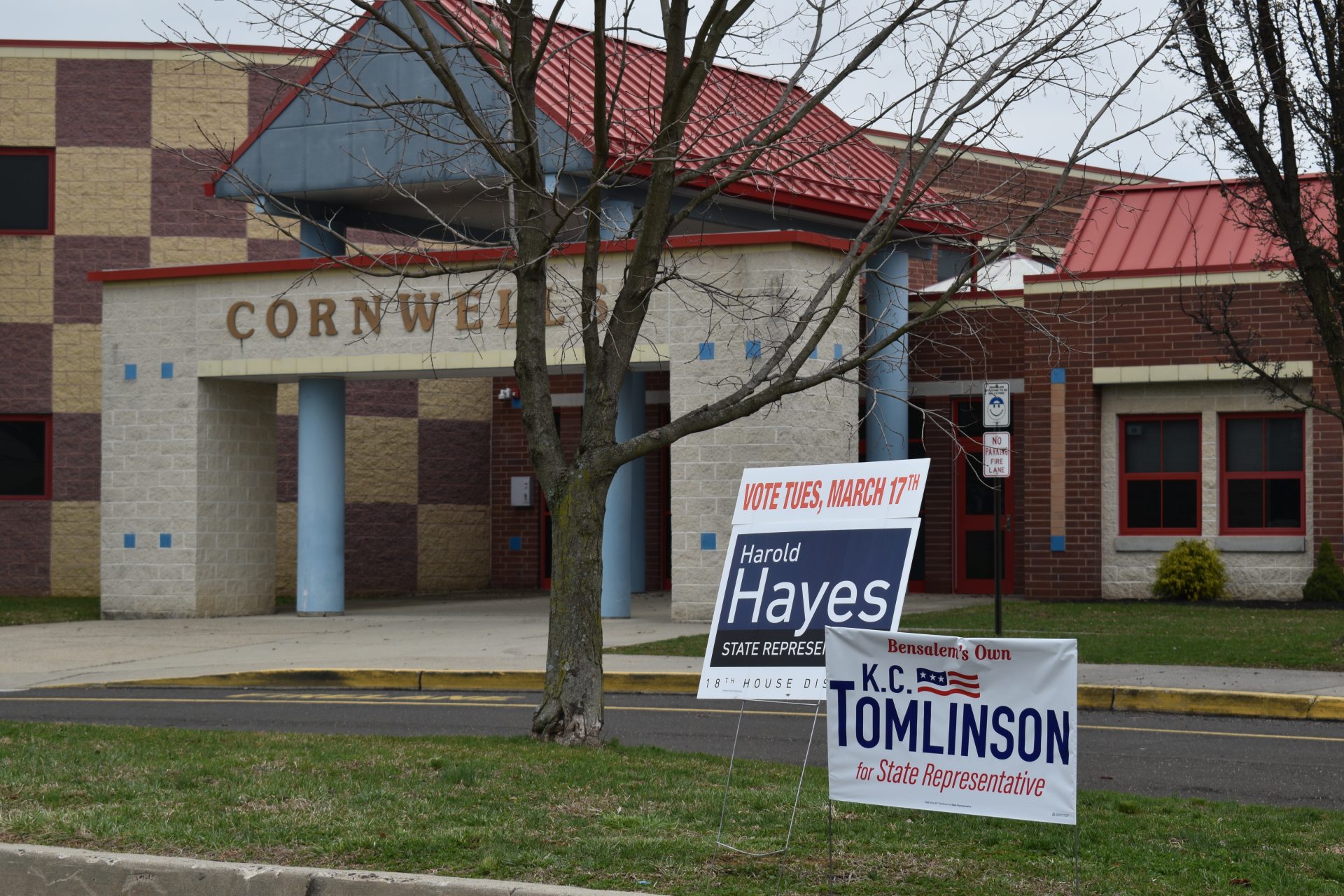 Dan Mortimer, a custodian at Cornwell Elementary School in Bensalem Township, cleans doors leading into the polling place for two precincts during Tuesday’s special House district 18 election.