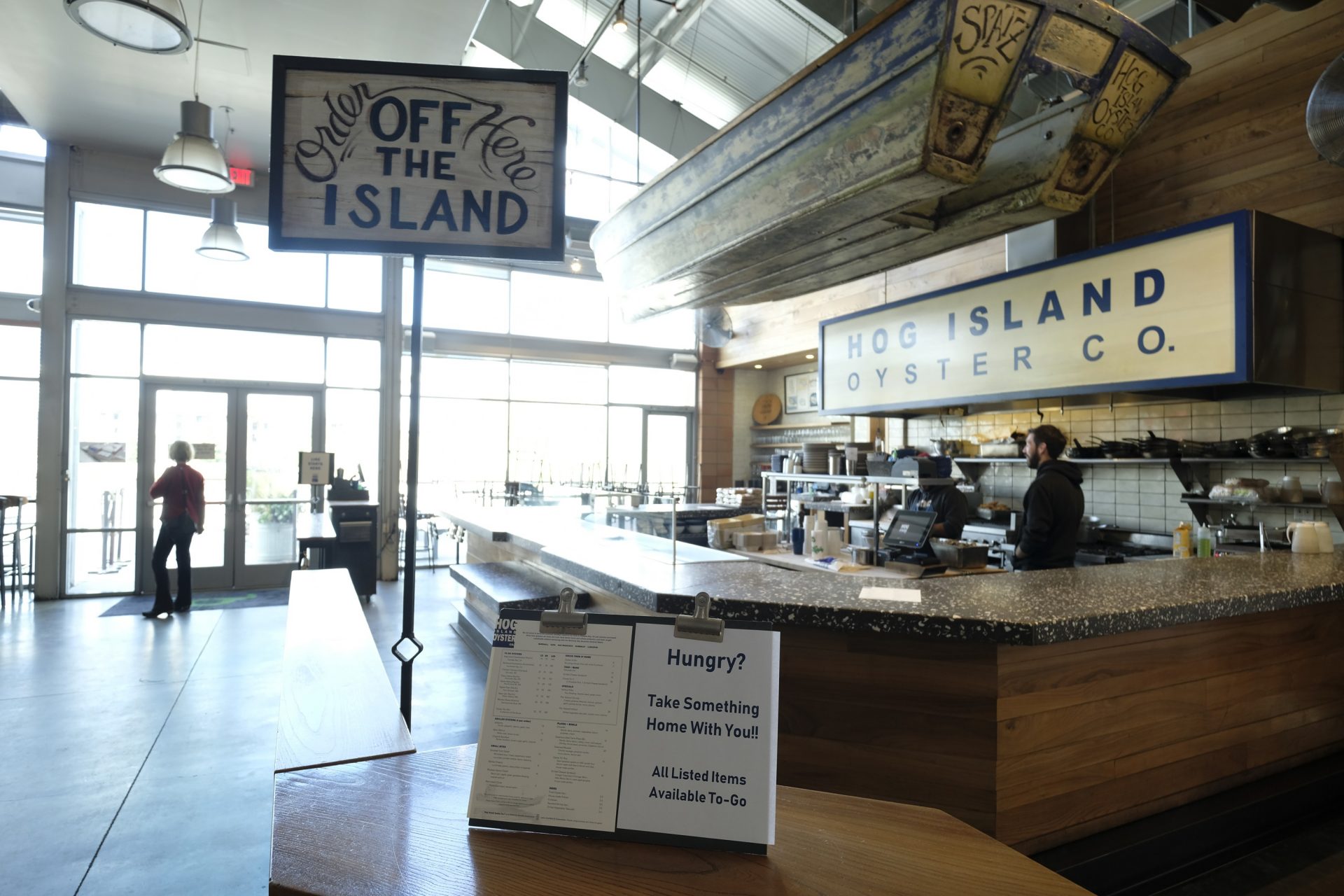 The popular Hog Island Co. oyster bar sits empty at the Oxbow Public Market, but remains open for takeout orders only Thursday, March 19, 2020, in Napa, Calif. As worries about the spread of the coronavirus confine millions of Californians to their homes, concern is growing about those who have no homes in which to shelter