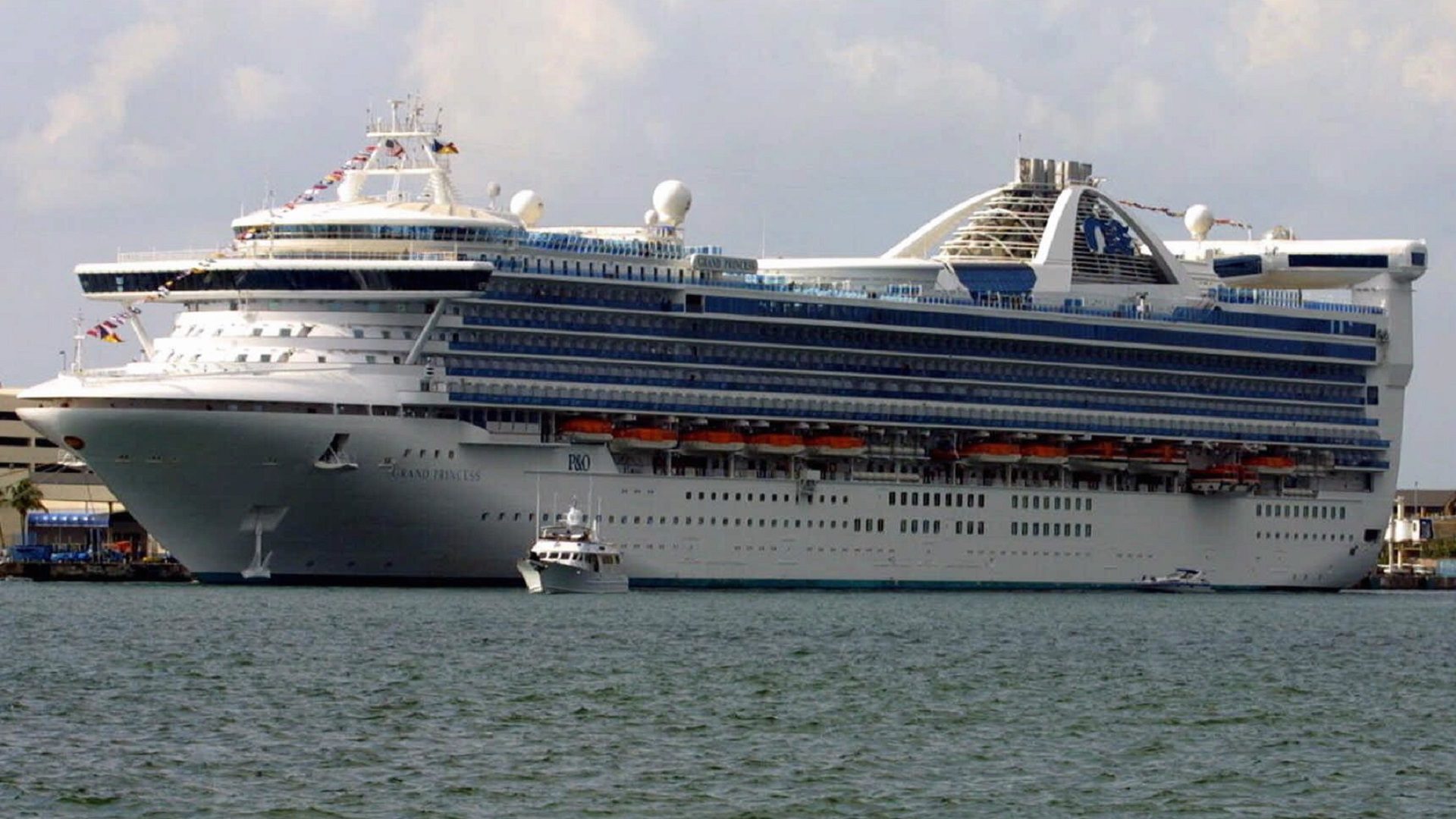 At least 100 people aboard the Grand Princess cruise ship will be tested for the coronavirus that causes COVID-19, after a former passenger died from the disease this week. The ship is seen here in a photo from 2001.