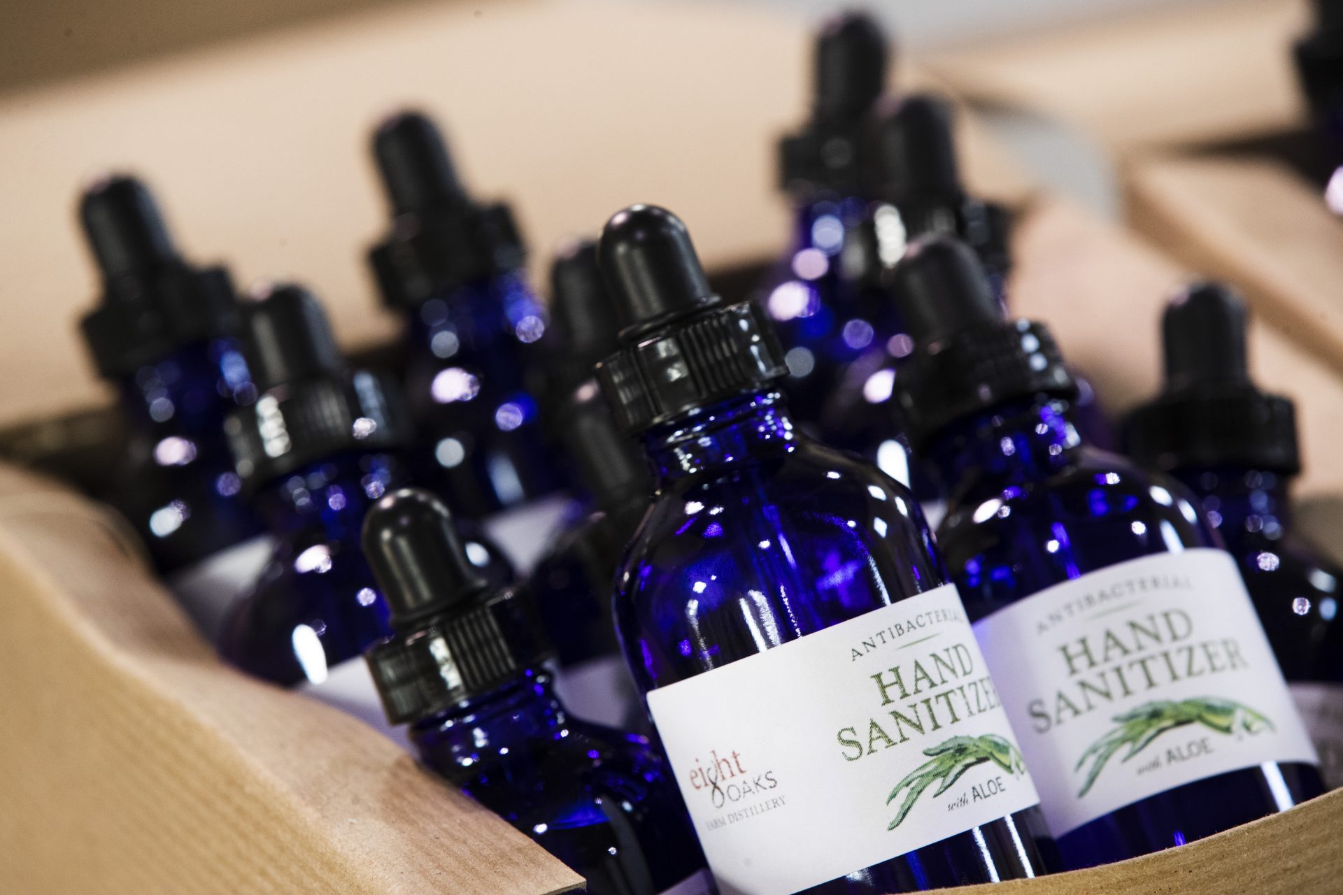 Bottles of hand sanitizer made at the Eight Oaks Farm Distillery sit in a display box at the distillery in New Tripoli, Pa., Monday, March 16, 2020. The distillery's owner, Chad Butters, grew increasingly angry as he saw the skyrocketing price of hand sanitizer. So he's temporarily converting his operation into a production line for the suddenly hard-to-find, gooey, alcohol-based disinfectant.