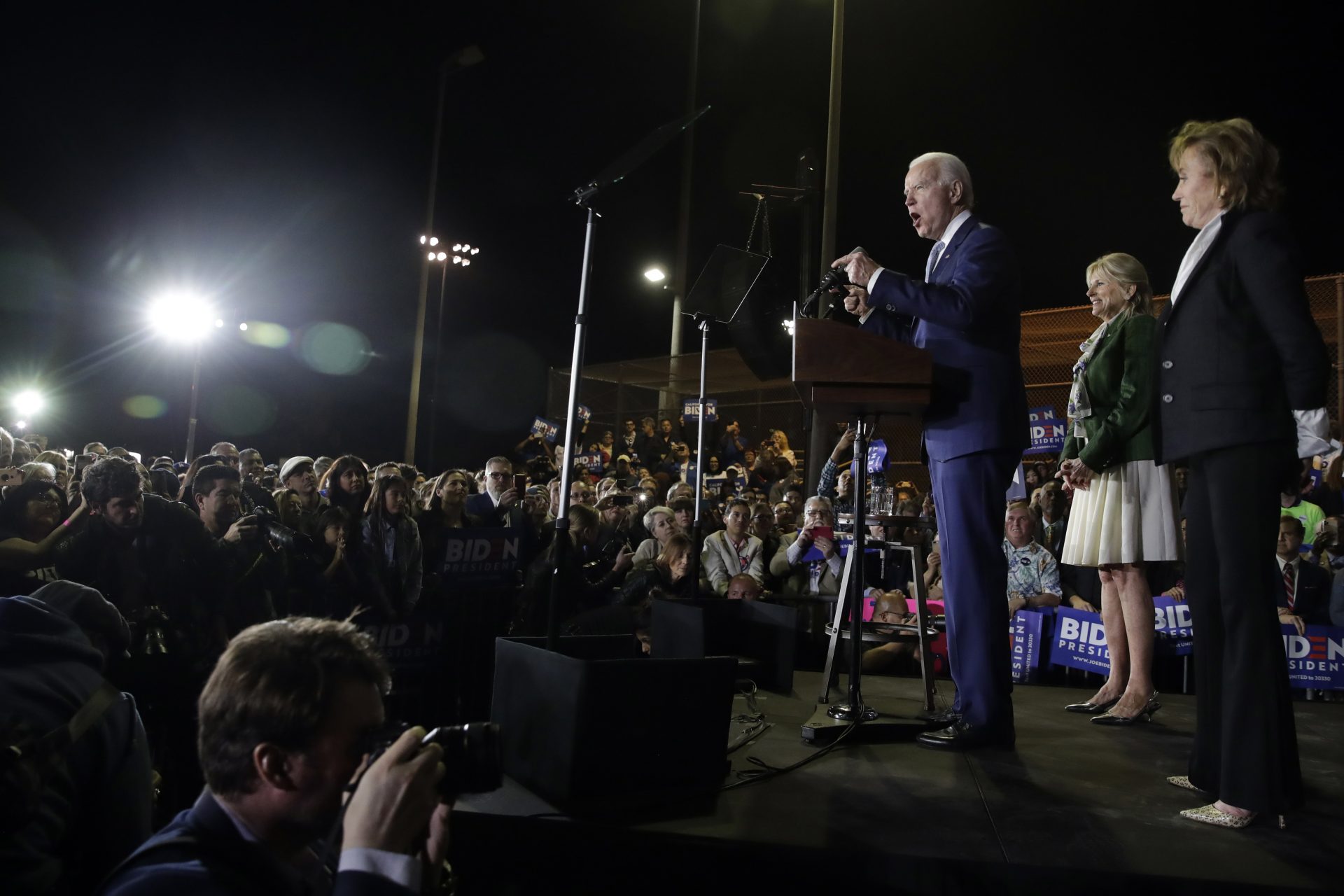 Democratic presidential candidate former Vice President Joe Biden, center, speaks in front of his sister Valerie, at right, and wife Jill, second from right, during a primary election night rally Tuesday, March 3, 2020, in Los Angeles
