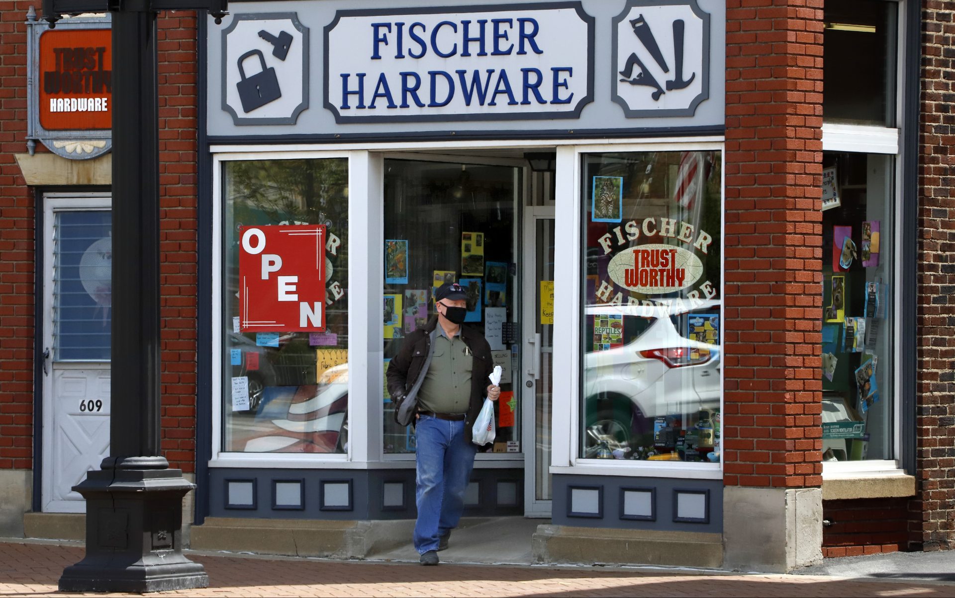 A customer exits Fischer Hardware in Beaver, Pa., Tuesday, May 12, 2020. Beaver County Commissioners have said they disagree with Pennsylvania Governor Tom Wolf and the county will act as if they are transitioning to the "yellow" phase on May 15. Pennsylvania Governor Tom Wolf announced, May 8, that 13 southwestern Pennsylvania counties, not including Beaver County, that would remain in the "red" phase where the stay-at-home order is still in effect, would move to the "yellow" phase on May 15.