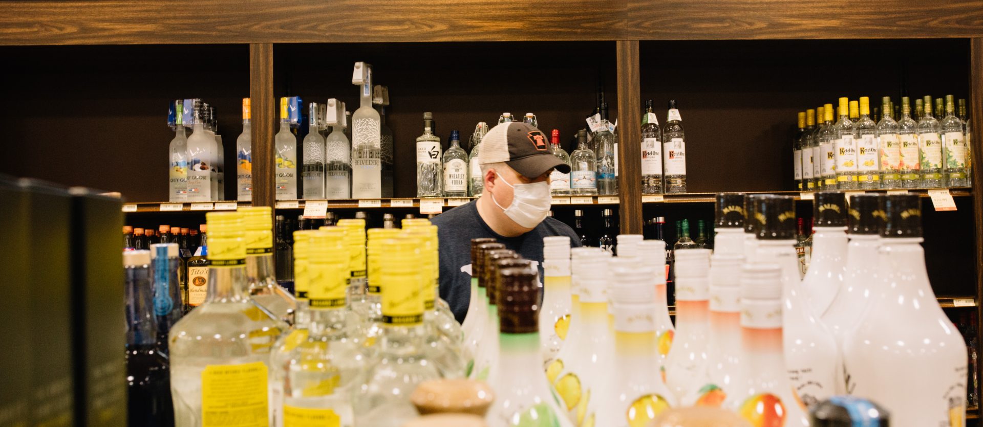 A customer wears a mask while shopping at a Fine Wine and Good Spirits store in Cumberland County on May 22, 2020, the first day the store reopened to shoppers after having been closed due to the coroanvirus.