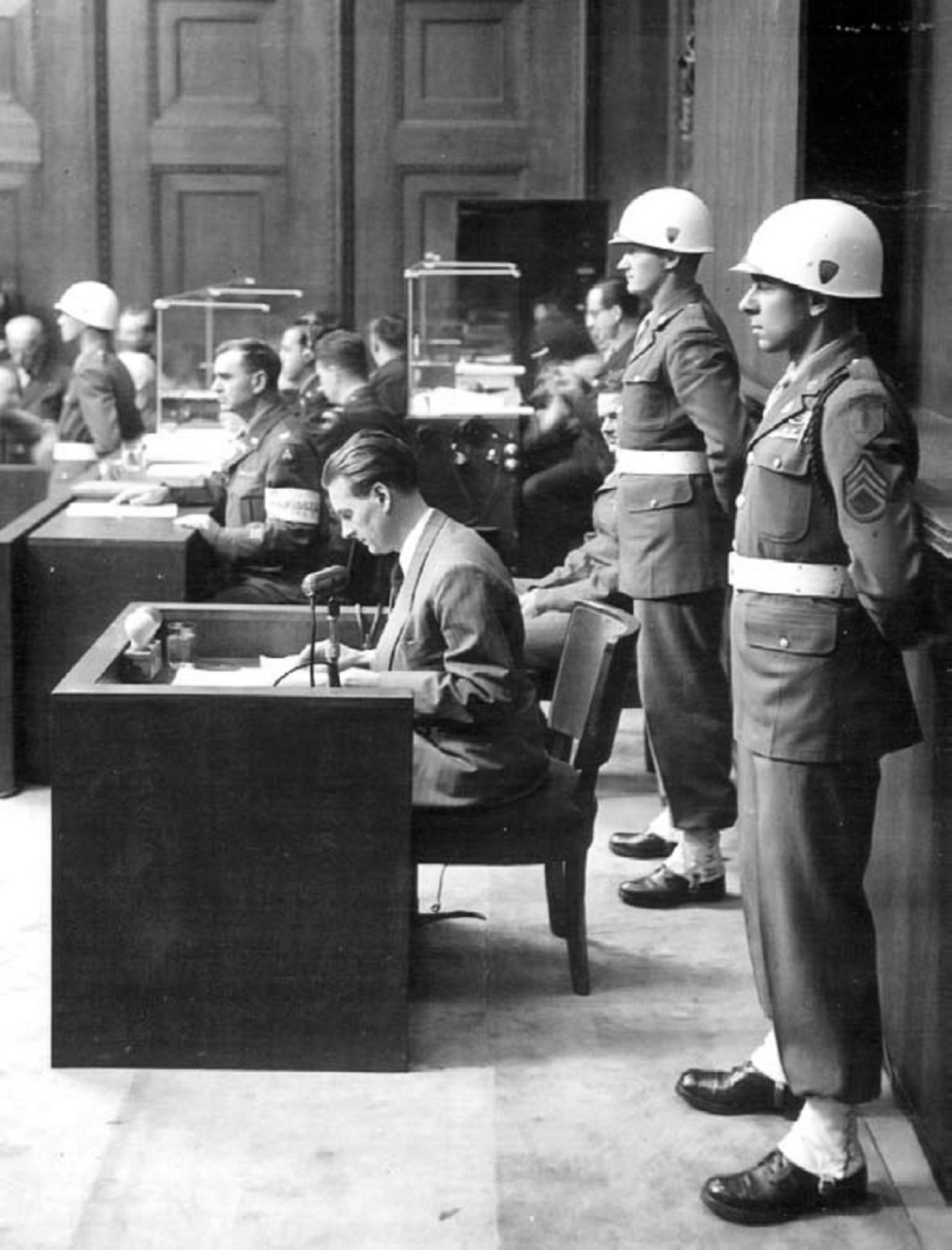 Staff Sgt. Emilio DiPalma (right) stands on guard at the Nuremberg Trials in 1945.