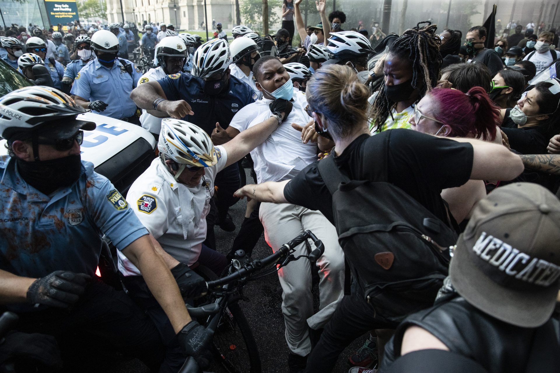 Police and protesters clash Saturday, May 30, 2020, in Philadelphia, during a demonstration over the death of George Floyd. Protests were held throughout the country over the death of Floyd, a black man who died after being restrained by Minneapolis police officers on May 25.