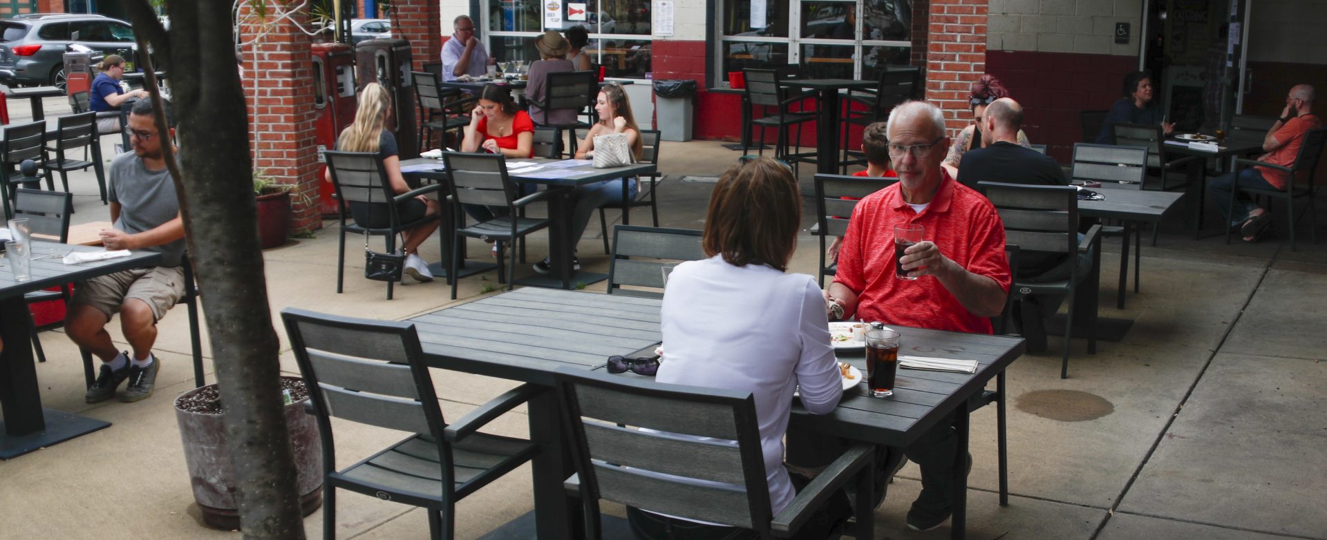 People take advantage of newly lowered COVID-19 protective restrictions in most of southwest Pennsylvania and have lunch outside on the re-opening day for seated patrons at a diner on Pittsburgh's Southside, Friday, June 5, 2020.