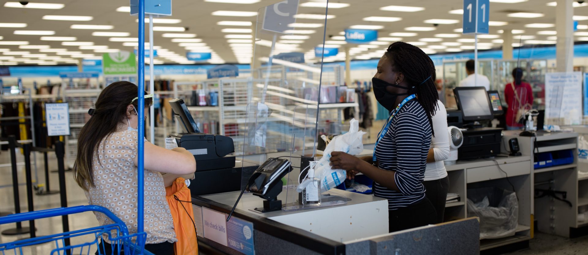A cashier and customer interact while wearing masks inside the Ross store on Jonestown Road in Harrisburg on Friday, June 19, 2020.
