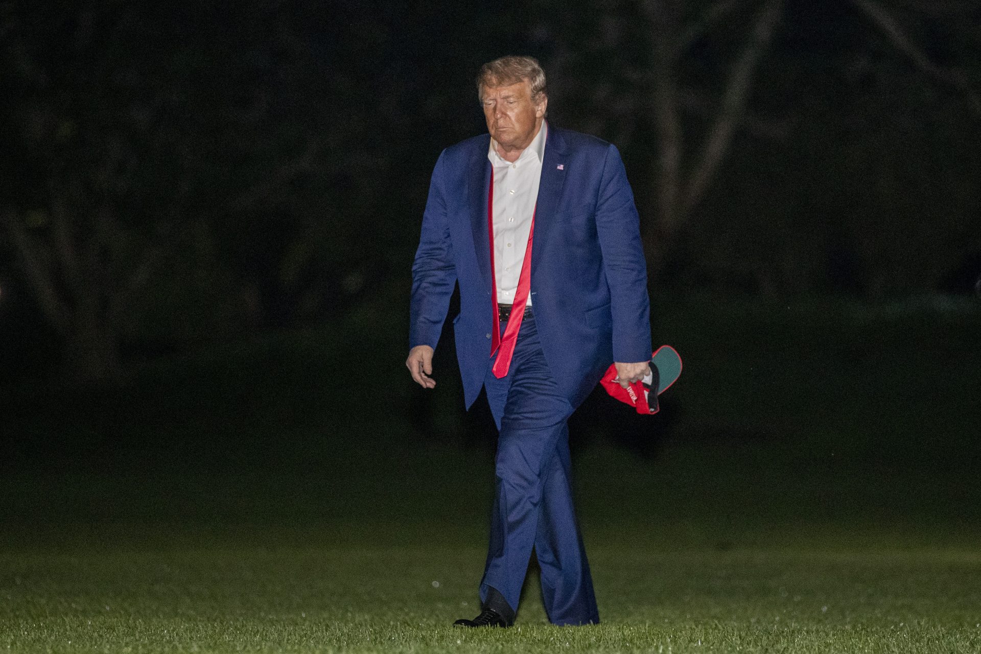 President Donald Trump walks on the South Lawn of the White House in Washington, early Sunday, June 21, 2020, after stepping off Marine One as he returns from a campaign rally in Tulsa, Okla.