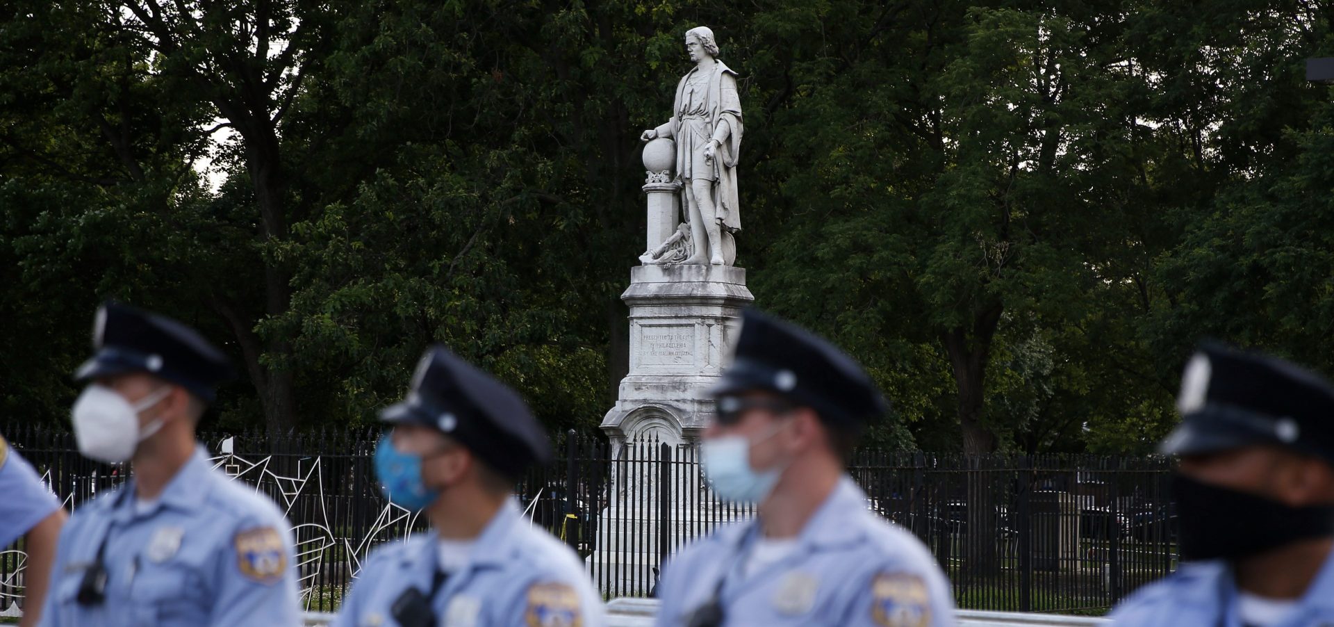 Philadelphia police officers gather near the statue of Christopher Columbus at Marconi Plaza, Monday, June 15, 2020, in the South Philadelphia neighborhood of Philadelphia.