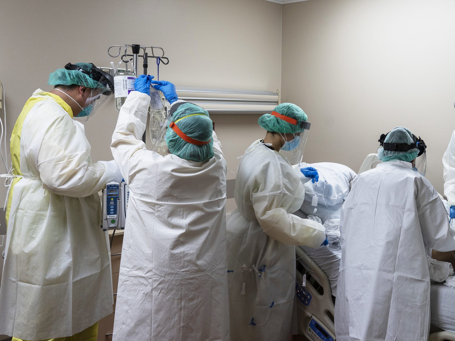 Members of the medical staff treat a patient in the COVID-19 intensive care unit at the United Memorial Medical Center on July 2, in Houston, Texas. More than 700 military health professionals are being sent to regions with spikes in coronavirus cases, including Houston.