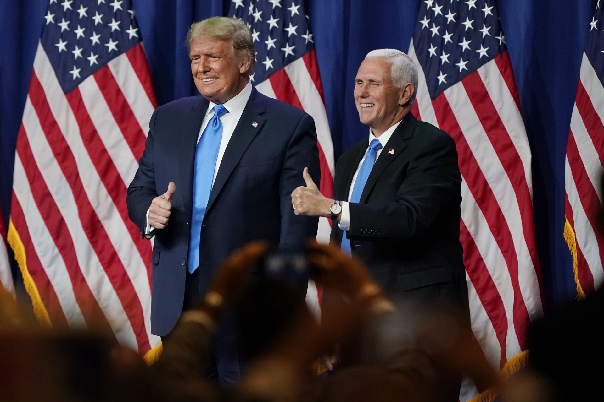 President Donald Trump and Vice President Mike Pence give a thumbs up after speaking during the first day of the Republican National Convention Monday, Aug. 24, 2020, in Charlotte, N.C.