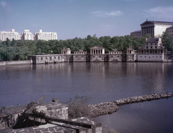 The Schuylkill River flows through Philadelphia, with the Fairmount Waterworks and the Philadelphia Museum of Art in the background. 