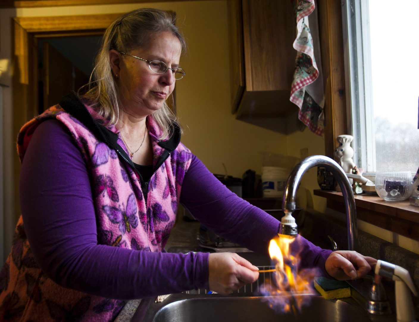 Sherry Vargson, who leased the mineral rights under a portion of her farm to the gas company Chesapeake Energy, illustrates her assertion that methane has leached into her well water by lighting the water on fire as it pours from her kitchen sink in Granville Summit.
Scientists want more access to baseline or 