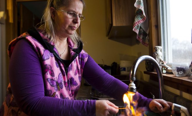 Sherry Vargson, who leased the mineral rights under a portion of her farm to the gas company Chesapeake Energy, illustrates her assertion that methane has leached into her well water by lighting the water on fire as it pours from her kitchen sink in Granville Summit.
Scientists want more access to baseline or "pre-drill" water tests results from private wells to understand issues like methane migration.
