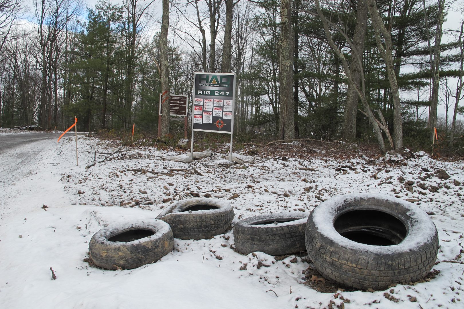 Discarded tires next to a gas well pad in the Tiadaghton State Forest.