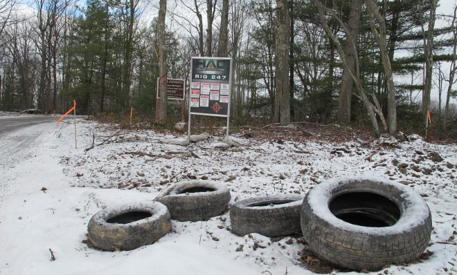 Discarded tires next to a gas well pad in the Tiadaghton State Forest.