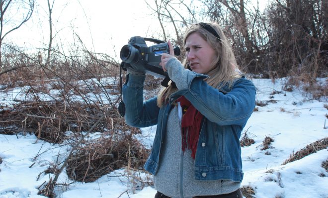 Researcher Melissa Sullivan uses an infrared FLIR camera to determine if methane is leaking from a well site.