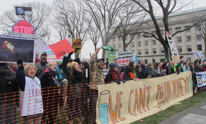 In this 2015 file photo, people demonstrate against fracking at Gov. Tom Wolf's inauguration. Eight people were arrested, but charges were later dismissed. 